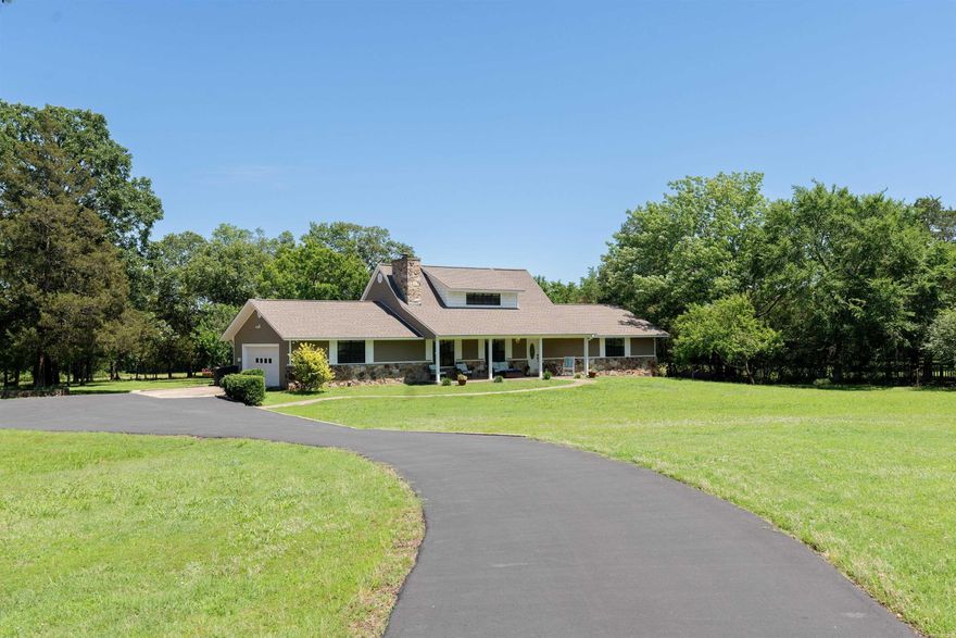 Well kept and cozy home.   Immaculate in every way.   Ideal hobby ranch property.   Fenced pasture with livestock stable and pond.  Three outbuildings two of which are 30x 24 shops.    Home and shops are whole house generator.    This beautiful property is a must see.