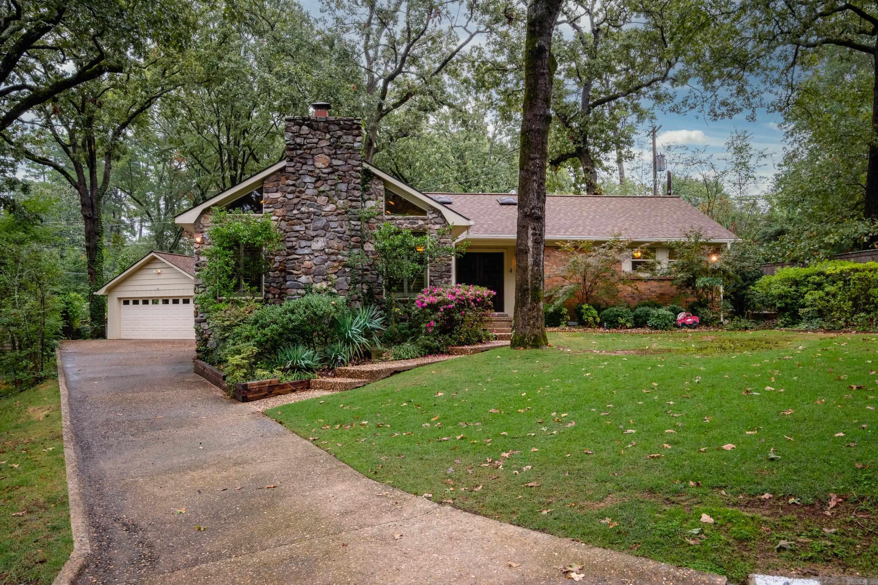 This beautifully built & styled home is a treat so don't miss it! Located on a cul-de-sac street w/ great curb appeal - Stone front plus curved driveway to the back & extra landscaping. Home was updated in the past 5 years: Pella windows & doors, Plantation shutters, hardwoods throughout most of home, tile in the kitchen & baths, carpet in 2BRs. Kitchen w/ Quartz counters & tile backsplash, appliances include smooth top electric range, wall oven & microwave plus dishwasher & pantry. Huge Great Room w/ vaulted ceiling & fireplace w/ gas logs. Off the kitchen/dining is large sunroom w/ beautiful windows overlooking the backyard. Large laundry room w/ sink & storage. All bedrooms are nicely sized & 2 have walk-in closets. Middle BR currently used as a workout room has a skylight, no exterior window. Both bathrooms have updated counters, floors, toilets & walk-in marble showers. Roof (2020). Whole House Generator installed 2017. French drain work on both sides of home to correct water flow (Residential French Drains). Home has leaf guard gutters system. Garage is 22X22 & has floored attic space above. Agents - see remarks.