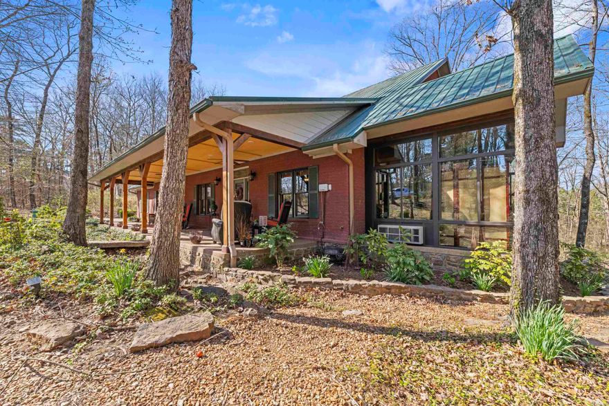 Step into this beautiful custom-built home brimming with character and charm1 Upon entering you'll immediately be captivated by the stunning fireplace and the seamless flow into the dream kitchen, dedicated home office, and the impressive vaulted wood ceiling! The spacious master bedroom offers a tranquil retreat and opens to a covered patio oasis, where you can unwind to the soothing sounds of the water feature and Koi pond. Enjoy the beautiful sunroom, perfect for relaxation & immersing yourself in nature. This home also boasts a 3 car garage, a versatile workspace under the house, and an exceptionally clean professionally sealed crawlspace with humidity control.  Added bonuses include: a built in media cabinet with surround sound, a comprehensive security system with 7 hardwired outdoor cameras and DVR, and a convenient sprinkler system Embrace riverside living! This unique property includes access to the river and a community boat dock.