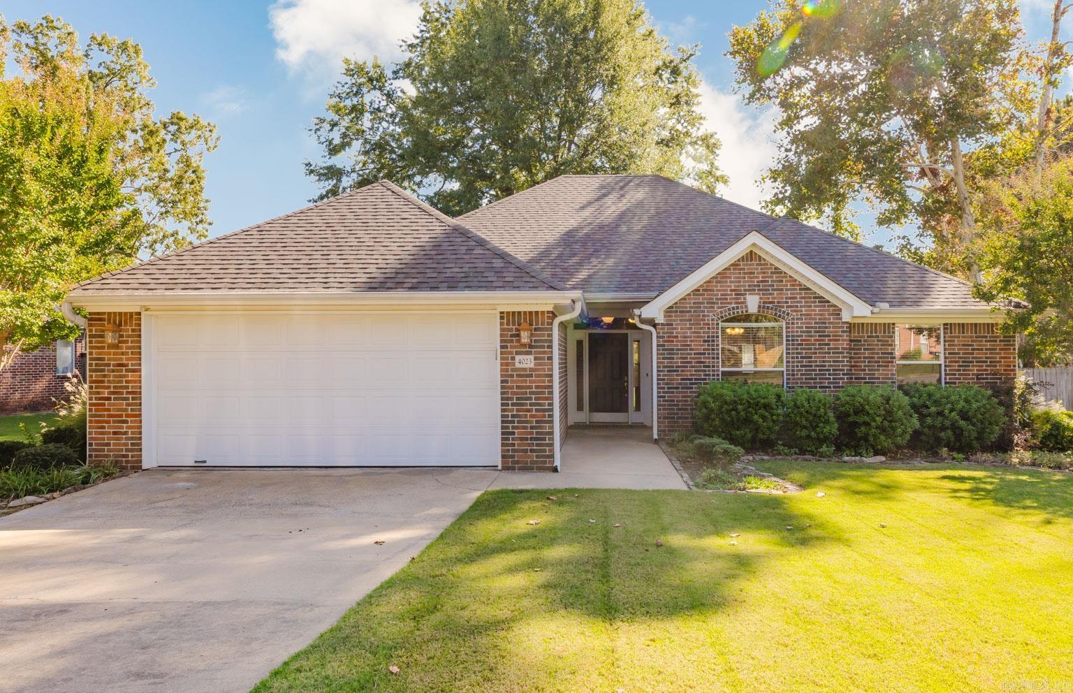 This beautifully maintained 3-bedroom, 2-bath home offers a smart layout with modern updates throughout. The primary suite features a relaxing jetted tub, separate shower, and two closets for added storage. The open living spaces flow easily into a well-equipped kitchen with updated GE appliances (2023). Enjoy the fenced backyard with sprinkler system, fire pit, and new east-side fencing (2023) which is perfect for quiet evenings or entertaining guests. Additional highlights include a 2-car garage, dedicated laundry room, new roof (2020), carpet in bedrooms (2019), and Leaf Filter gutters with a transferable warranty (2024). Situated in the sought-after Heritage Farm subdivision, residents enjoy access to a community pool, pavilion, and playground for easy outdoor enjoyment.