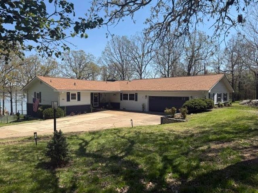 REMODELED LAKE HOUSE ON 105 ACRE DIAMOND LAKE.  It has been updated through out with new commercial appliances, on demand hot water heater, bathrooms fixtures, gas log fireplaces, huge master bedroom closets, his and hers, kitchen cabinets, new covered boat dock, new laundry room, fenced back yard, storage shed and to many other things to mention. Stove, refrigerator, washer, dryer, dishwasher, microwave and hot tub all are included. If you are interested in the furniture it is possibly negotiable, for a move in ready house.  If you are looking for a house with privacy and four lots you must see this one. Call for an appointment and come see what you think today before it is gone.