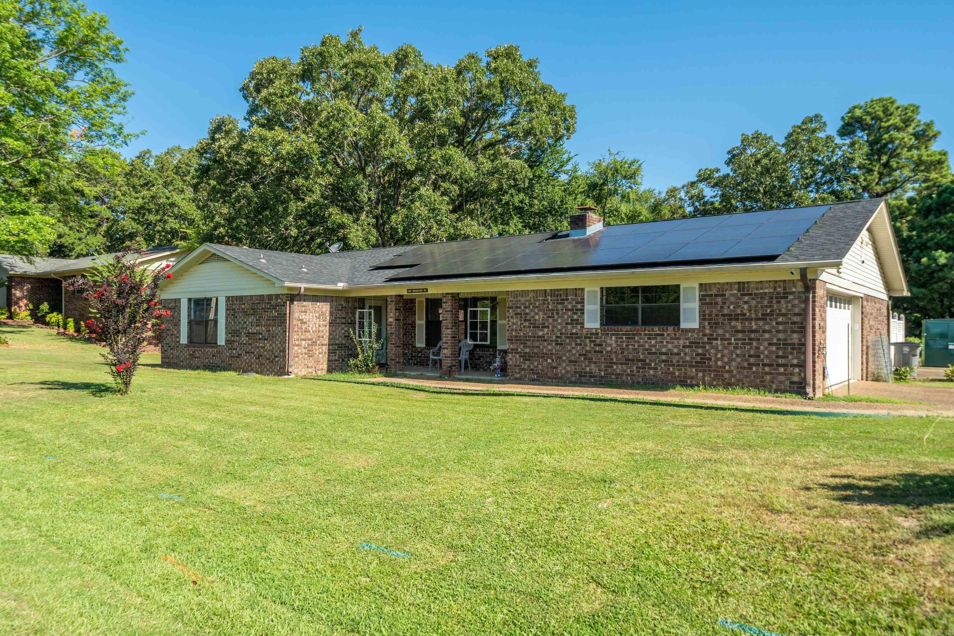 This brick corner lot home is a great find for your personal home or your short-term rental. S-T-R LICENSE IS IN PLACE! Formal living and dining with fireplace which is currently being used as a fourth bedroom. Cozy den on the back. Second oversized cooled garage that could be used as a game room, hobby headquarters, shop, storage, or a home for extra vehicles and toys. Garage has a separate entrance off of courtyard. Nice paved, fenced courtyard for your entertaining. Whole house generator with propane tank. All bedrooms have walk in closets. With a little updating, what a place you could have for the price. Roof is partially solar panels. You can't get much closer to Sam's Pizza Pub!