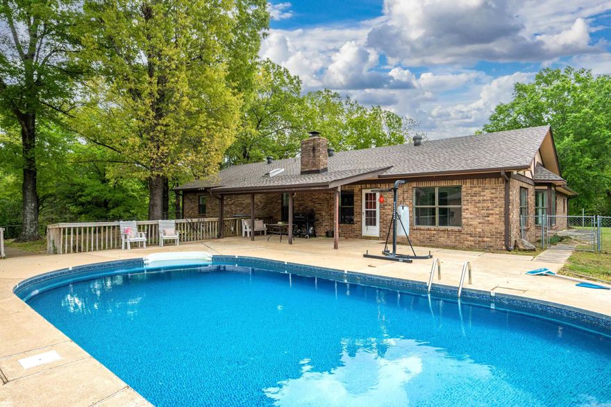 Get ready to fall in love with this one-of-a-kind property! From the moment you arrive, the long private driveway sets the tone for space, privacy, and endless possibilities.  Cool off all summer long in your sparkling swimming pool, complete with your very own private cabana—perfect for relaxing, entertaining, or weekend staycations right at home!  Situated on 5.43 acres of beautiful countryside, this property is ready for whatever you dream up—horses, a garden, outdoor entertaining, or simply room to roam and enjoy the peace and quiet.  Inside, you’ll find a stunning kitchen featuring gorgeous quartz countertops, a cozy fireplace for those relaxing evenings, and a HUGE laundry room that makes everyday living a breeze.  Need space for hobbies, storage, or projects? You’ve got it—plus a shop, tons of parking, and a two-car garage!  All of this located in the highly desirable Lake Hamilton School District—this one truly checks all the boxes.  So much space. So much charm. So much WOW—don’t miss it!