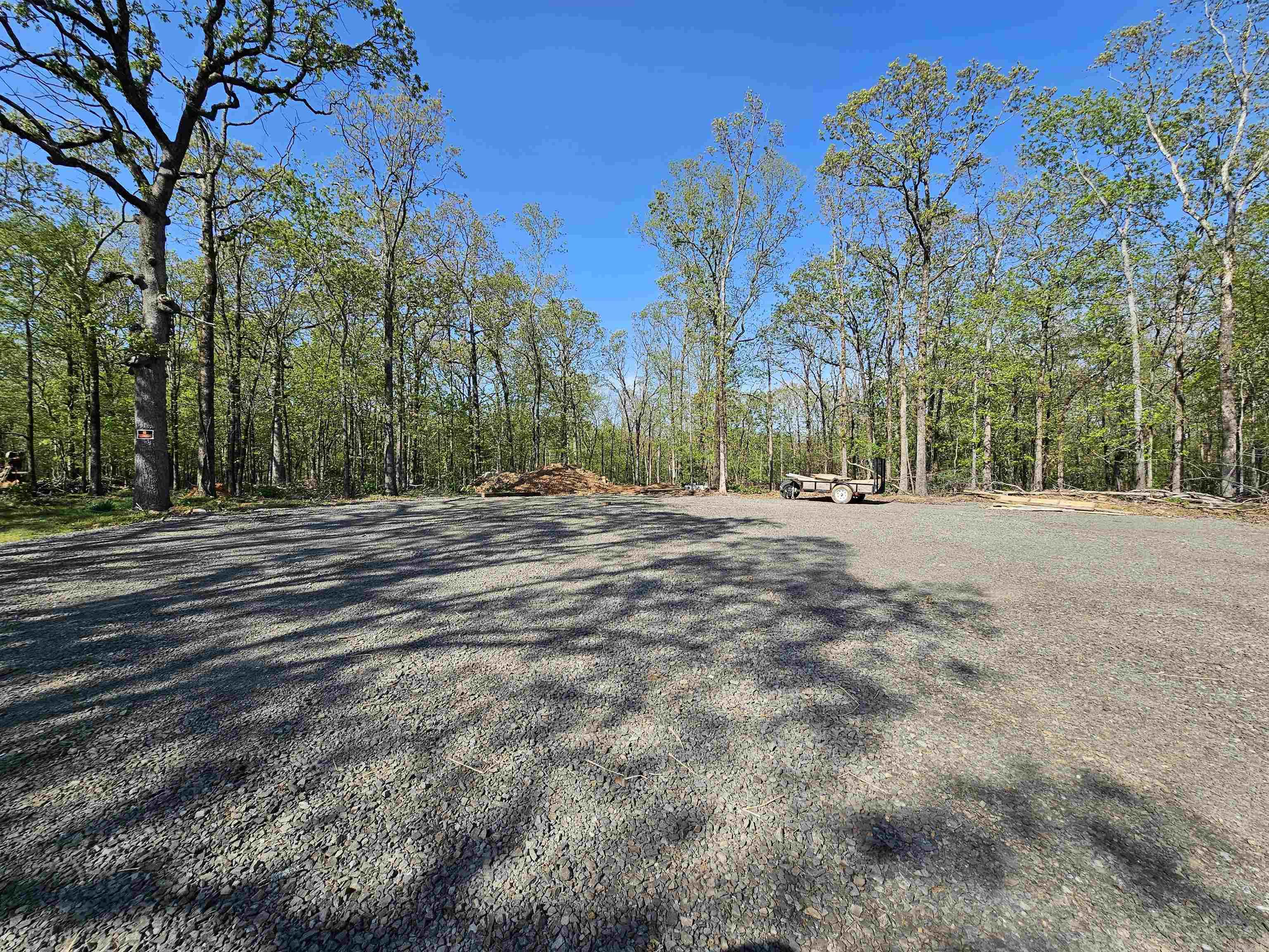 This land is ready for construction. The road, utilities and fire hydrant have already been put in place. The owner has already cleared an area for a home site and a shop. The location is perfect...situated next to Bushwood Estates subdivision and is convenient to everything.