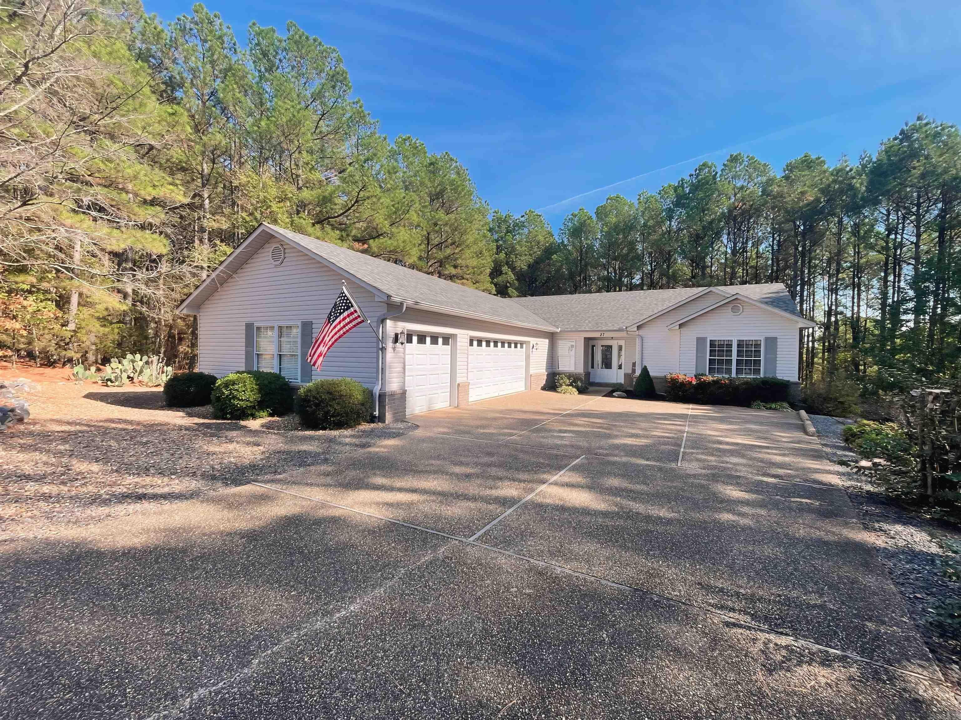 Gorgeous, Updated, East Side home on a large landscaped lot! This 3 bedroom, 2 bath home features wood and tile flooring throughout (no carpet), an open concept for todays modern family and perfect for entertaining. Master suite boasts a new tile walk in shower, double closets, jetted tub, cathedral ceilings, and loads of natural light. There are 2 large guest rooms seperate from the Master as well as a 12x12 heated and cooled bonus room (not included in sq footage), accessible from outside, that is currently being used as a home gym. Kitchen and laundry room both feature an abundance of bright white cabinetry. Corian counters in the kitchen, breakfast bar for additional dining space, & an entire wall of windows for natural light throughout the day. Entertain your family and friends on the large covered back deck overlooking the yard. The trees create privacy from neighbors and add to the feeling of peace and seclusion! You'll find added storage beneath the deck as well as a 3 car garage with a staircase into the floored attic for easy access. The list goes on and on, so don't miss out on this one!!!