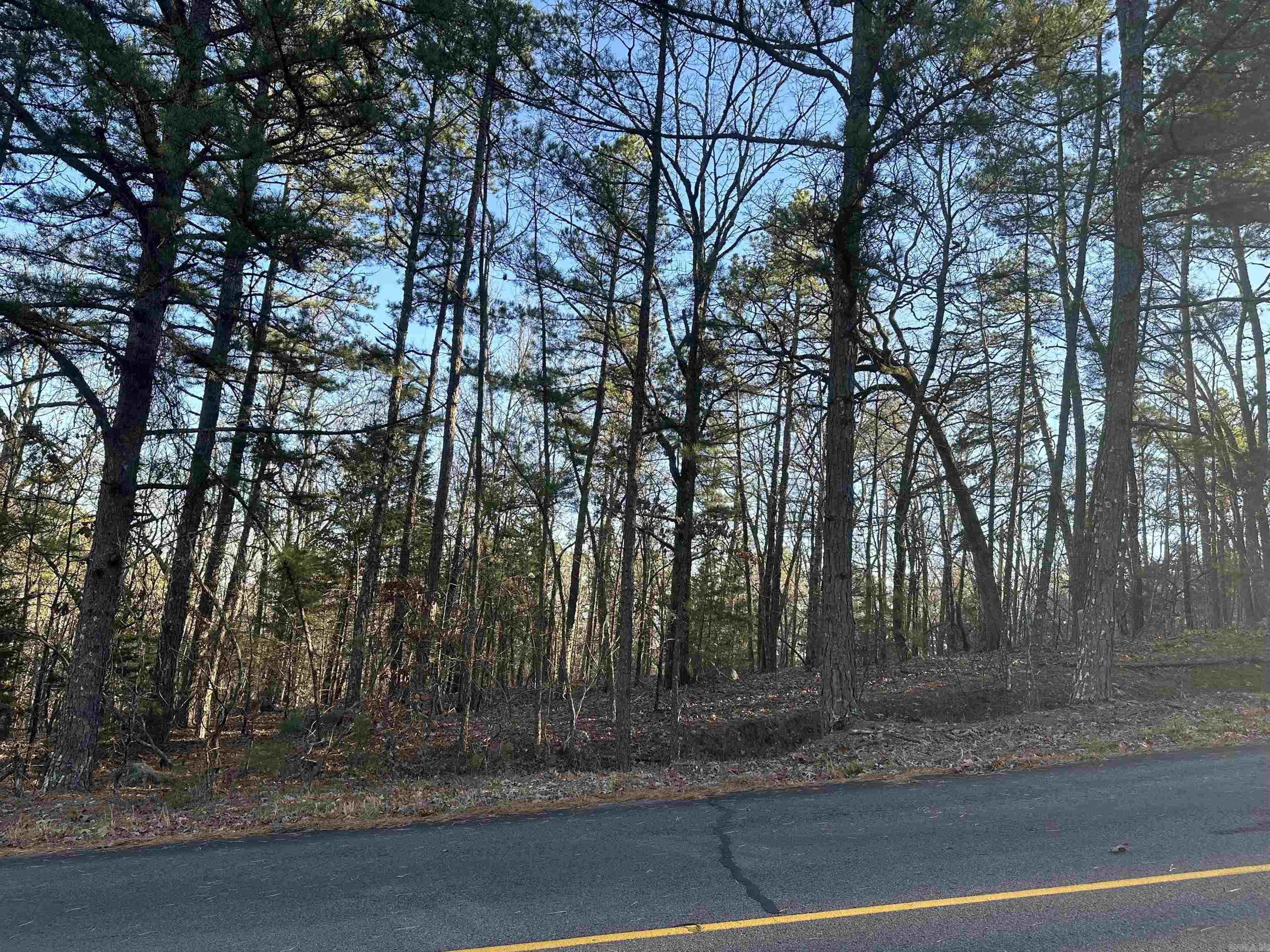 Vacant wooded lot with plenty of space to build your dream home! Central to HSV lakes, golf, trails, restaurants and more HSV amenities! Note to Buyers: there is a POA New Member Buy-In Fee required at closing.