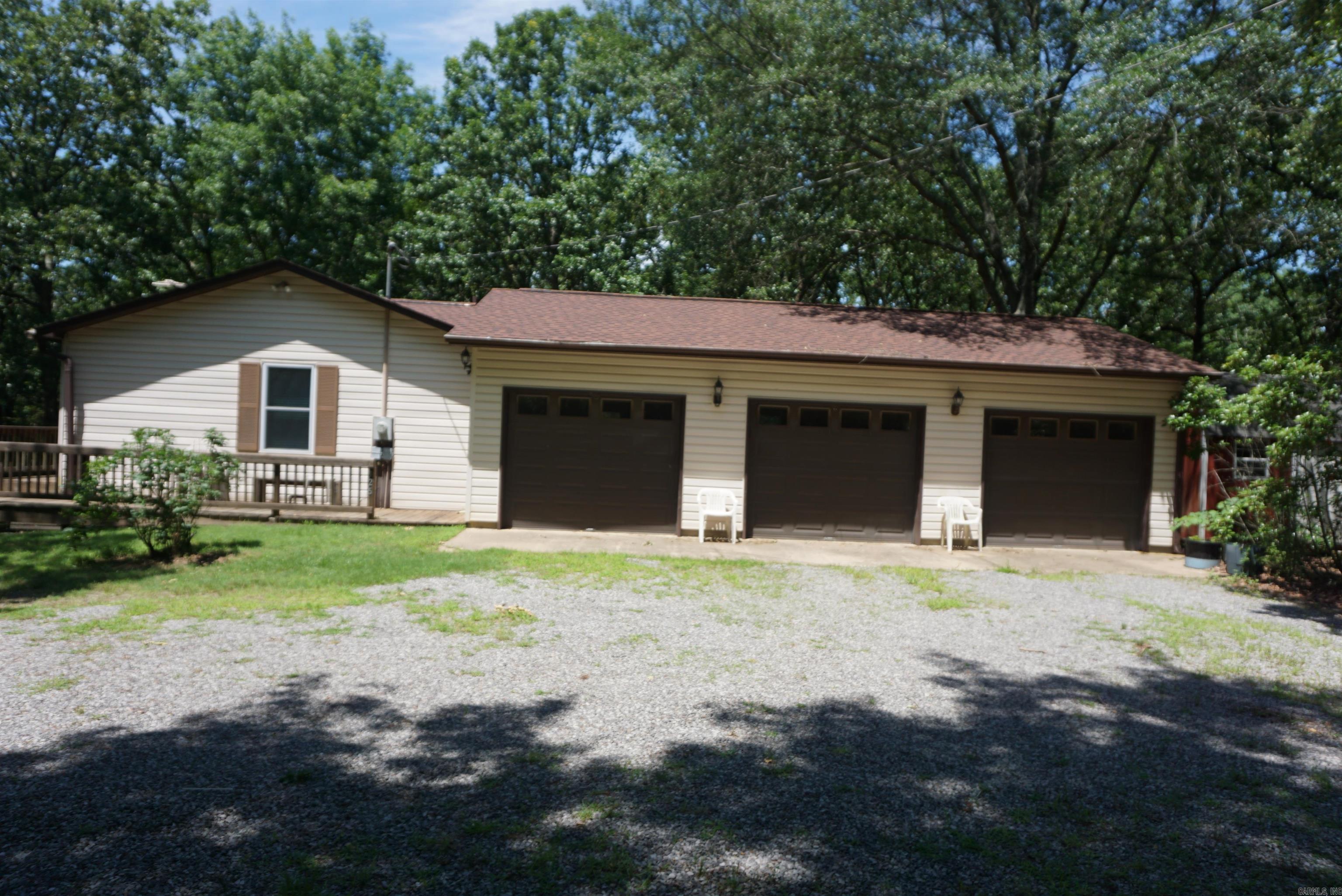 1 owner home sitting on almost 9 acres on the outskirts of Searcy city limits, but only a couple of minutes to downtown Searcy. House sits Way off Johnston Rd, can't see if from the road so super private. The courthouse records shows 1344 sq ft. Then add the same for the walk out basement that is heated and cooled through the central heat & air system. Upstairs you have the main house with 3 bedrooms, 2 full bathrooms, beautiful kitchen with large island and plenty of countertop space, nice cabinets, and a pantry plus a separate dining room and living room. One of the bathrooms upstairs has a walk in shower and the other has a tub/shower unit. The walk out basement has a huge open game room type area, 2 bedrooms or could be an office, craft rooms or bedrooms plus the laundry room with a laundry chute from the upstairs bathroom. The 3 car garage has a workbench area, plus a very nice Bald Eagle storage bldg and a fenced in yard. New Roof in August 2024. Security cameras in use. (