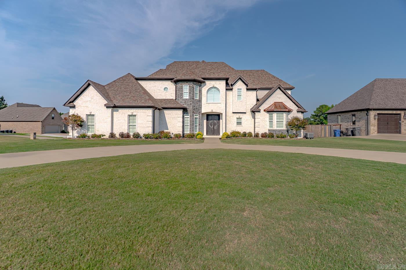 Welcome to Market 3529 Farmington Dr. of the Barrington Park Sub. in Jonesboro, AR within the Valley View School District. Situated on a .38 +/- privacy fenced corner lot w/ circle drive is a Jim Abel 2020 built Modern French Country style home, wrapped in brick, topped w/ architectural shingles and accented by a stone turret, side entry garage, sunroom, ornate front doors, guttering, and lavish landscaping. The interior features 3,218 sf of well laid out living space over 2 floors. The main level features: a living room w/ soaring ceiling, electric fireplace w/ stone surround, chandelier and access to the sunroom, an eat-in kitchen w/ stainless steel appliances, and pantry, secondary kitchen, and dining room. The Master suite holds an en-suite w/ walk-in shower, jet tub, dual vanity, and walk-in closets. The 1st upstairs wing is a bedroom w/ 2 closets and en-suite w/ shower/tub combo and the 2nd upstairs wing features a spacious landing w/ 2 bedrooms and full bathroom w/ shower tub combo. You'll love the tile & hardwood flooring, high end fixtures, and quartz countertops. Conveniently located near local amenities. Call today to schedule your tour and make this house your home.