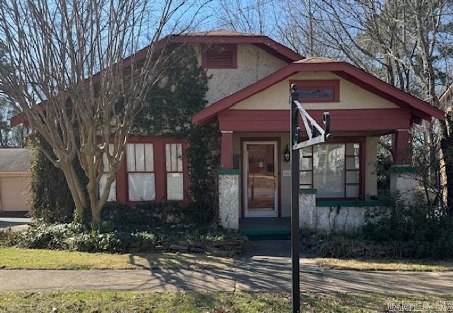 Located in the heart of Downtown Benton, this charming property, built in 1934, offers a unique opportunity to own a piece of local history. Originally designed as a home, it has been used as an office space for years, and could easily be converted back into a beautiful residence. The property also includes a smaller residence in the back, currently rented out for steady rental income. Whether you're looking for a potential investment opportunity or extra income while enjoying the main building, this property has it all.  3 parking spaces on the side and 3 in the back. Refrigerator conveys. New roof 7/2024