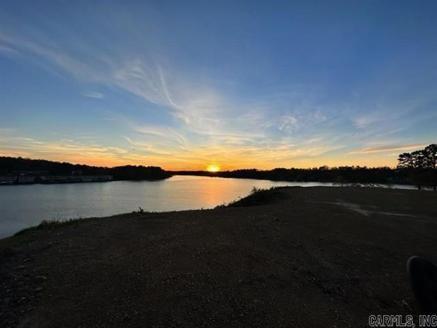 Stunning Main Channel Lot on Lake Hamilton- Premier Location! Discover the ultimate lakefront lifestyle with the exceptional Lake Hamilton lot located in a brand new, exclusive Subdivision. Perfectly positioned on the main channel, the property boasts 100ft of prime lake frontage and unmatched west-facing views of both north and south channels including the striking view of the 70 W. Bridge.  Enjoy breathtaking sunsets from your dream home's future deck or dock.  Owner/Agent