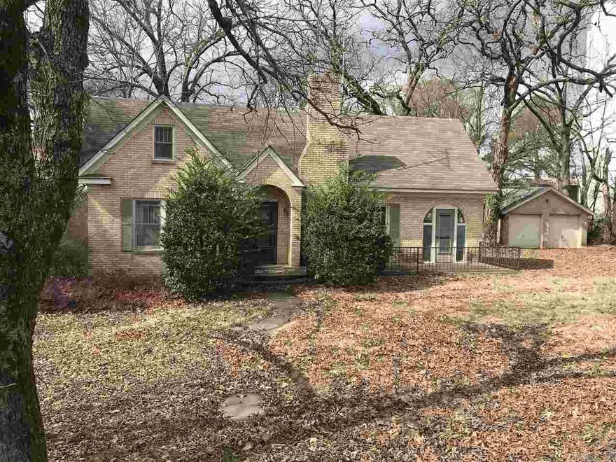 When Hitler was biltzkrieging Poland in 1939 someone was building this unique brick home in the heart of Bryant. Featuring Large Rooms, Fireplace, Basement, and two outbuildings. It's the perfect place for a business with a daily traffic count of 27,000! All offers for business subject to rezoning.