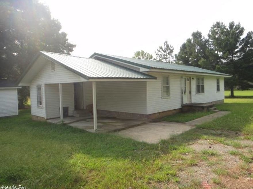 Quiet street, country setting. Nice 3BD/1BA with matching Storage building. Formal dining room has laminate flooring. Nice size living room. Tile in bathroom. Opportunity to increase value to this home. One acre provides plenty of space. Property is lender owned, is being sold as-is, and U.S. Bank is making no representation or warranties.  **See agent remarks**