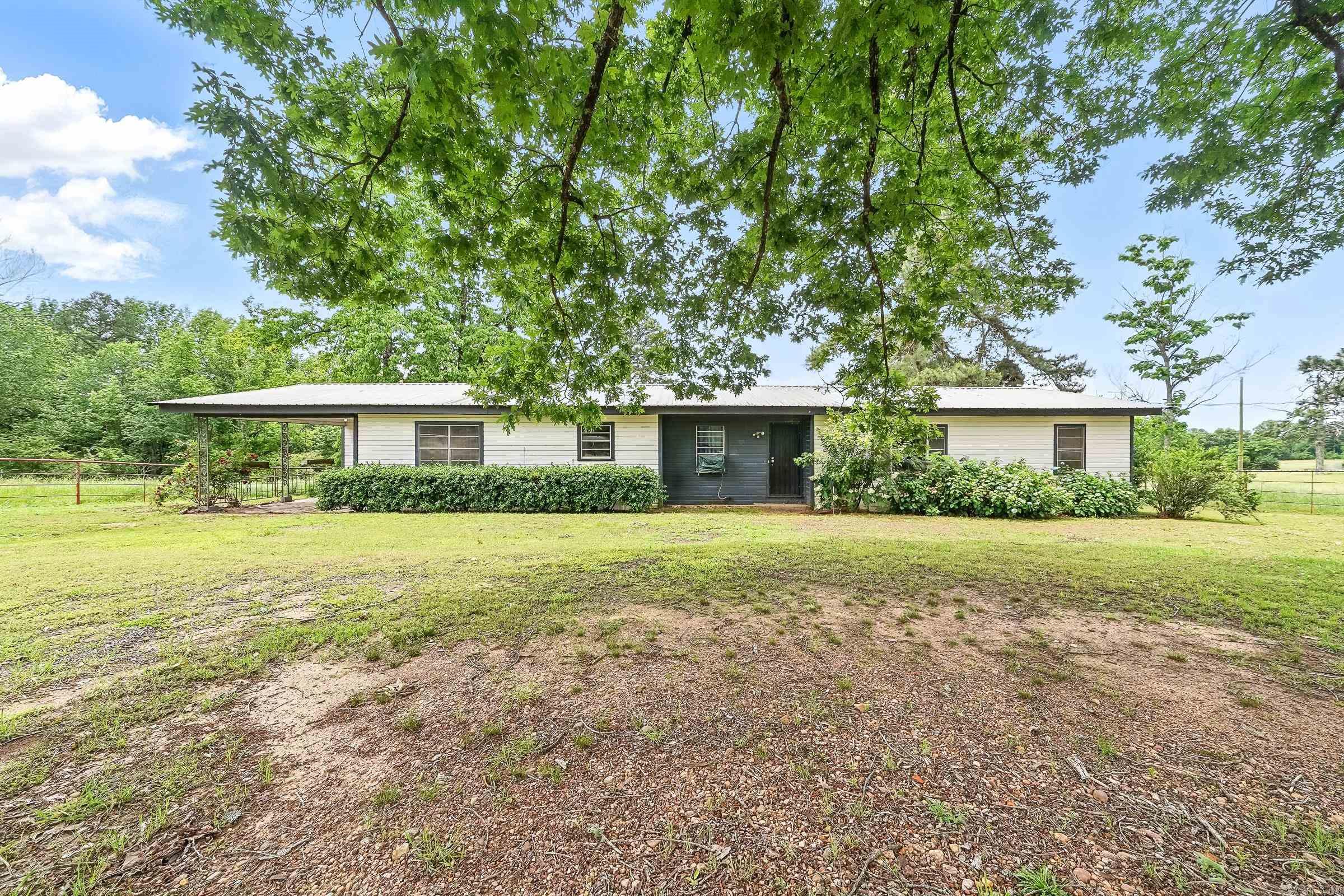 Enjoy the peaceful life of a dead end country road! A 2087 square foot home and 3 acres! There are 4+ bedrooms, 1 bathroom, and even a large laundry room with a door that open to the outside! It is close the Sevier County Medical Center but is still off the beaten path. It comes with its own butane tank for the gas cook stove, gas heaters, water heater. Plus there is a pellet stove! Plenty of storage in the room off the carport. If you are thinking of buying a home check this one out!