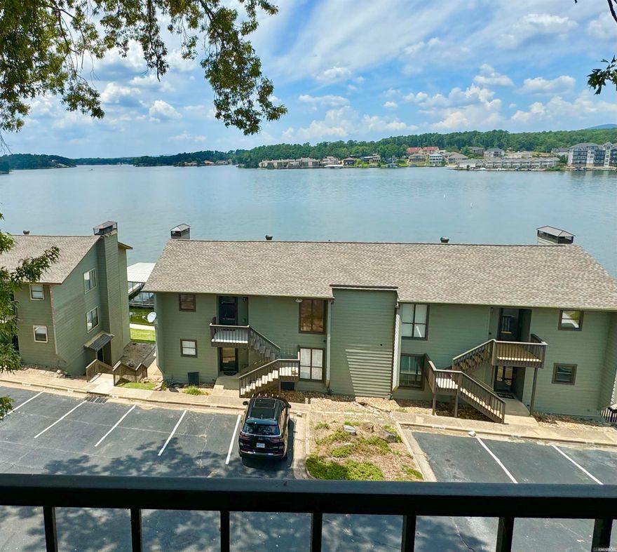 Beautifully updated Lake Hamilton condo with covered boat slip! The lake and mountain views from this 2BR/2BA condo are incredible.  It's the perfect place to watch the holiday fireworks. Very convenient Hwy. 7 South location.  All appliances and furnishings are included.  Amenities include a gated entry, swimming pool, pickleball courts and pavilion down by the lake.  Short term rentals are allowed in the complex, and this unit has a solid rental history.