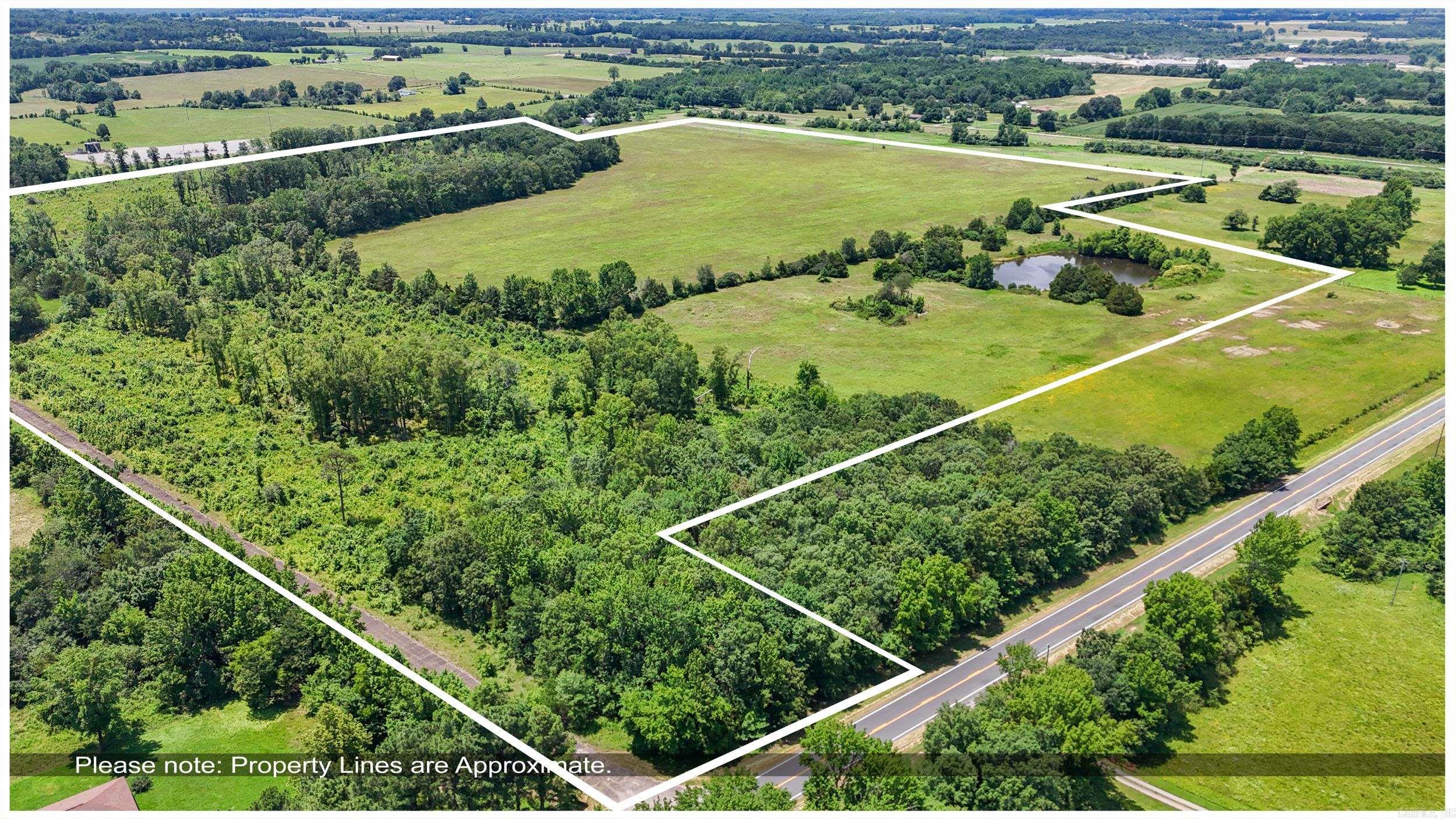 90+ acres with a large pond stocked with brim,catfish and bass and maybe some croppie the seller says. Acreage is pasture land hay is cut off of it every year and has some woods. Property has been in the seller's family a long time but it is too much to keep up with right now. Survey will determine exact acreage.