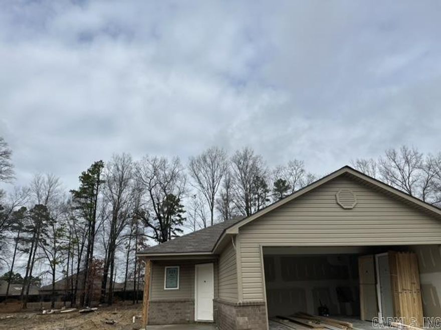 The Ridgeland plan has everything you need in a 4-bedroom plan! A covered porch and a clever offset front door lead to a wet area entry and a welcoming entry hall. The hall flows into an open-concept Kitchen, Dining area and Living Room. Bedrooms 2, 3, & 4 area gathered to the front of the house, and the Master Bedroom is to the rear and offers a generously sized Master Closet! 2-10 Homebuyers' Warranty included at no extra cost to the Buyer.   Valuable upgrades included in this home: 60" fiberglass stand up shower in Master Bath, plumbing faucet upgrade 2, 8" deep Kitchen sink, door bell, added cable jack, HVAC rigid duct upgrade, laminate flush bar top in Kitchen, Cheyenne style interior doors, baseboards level 2, 25in. wide attic stairs, double bowl laminate vanity in Master Bath, LED disk lights in Kitchen, full sod, stainless steel appliance package.   THIS HOME IS SCHEDULED TO BE COMPLETE IN MIDE FEBRUARY.