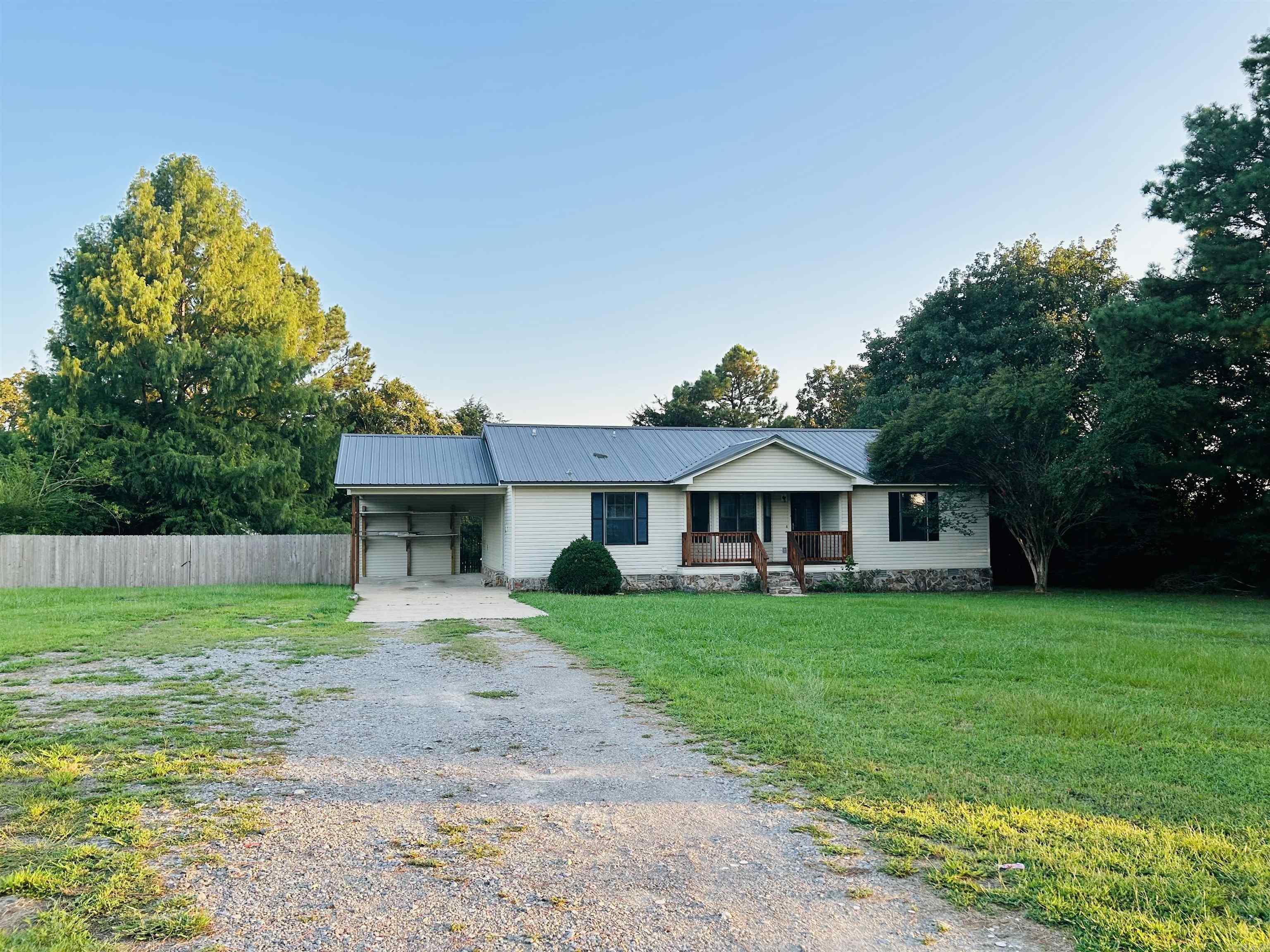 Donāt miss this cute 3/2 with split floor plan with rock and wood accents, large family room with a bay window and a place to add a fireplace. Granite and appliances STAY! Stained wood on front and back porches and black wrought iron fence to a fenced backyard with trees. Metal roof and fresh paint on the cabinets, closet doors and trim. Large lot, country living with easy access to the 13 bypass to get your destination. Make your appointment today! This one won't last!