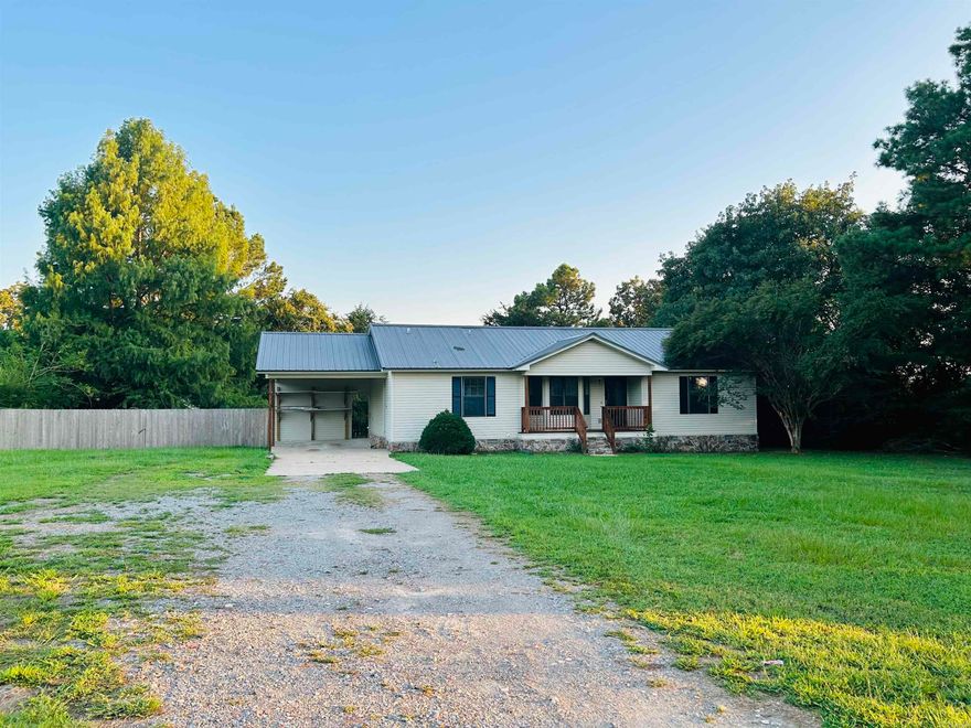 Don’t miss this cute 3/2 with split floor plan with rock and wood accents, large family room with a bay window and a place to add a fireplace. Granite and appliances STAY! Stained wood on front and back porches and black wrought iron fence to a fenced backyard with trees. Metal roof and fresh paint on the cabinets, closet doors and trim. Large lot, country living with easy access to the 13 bypass to get your destination. Make your appointment today! This one won't last!
