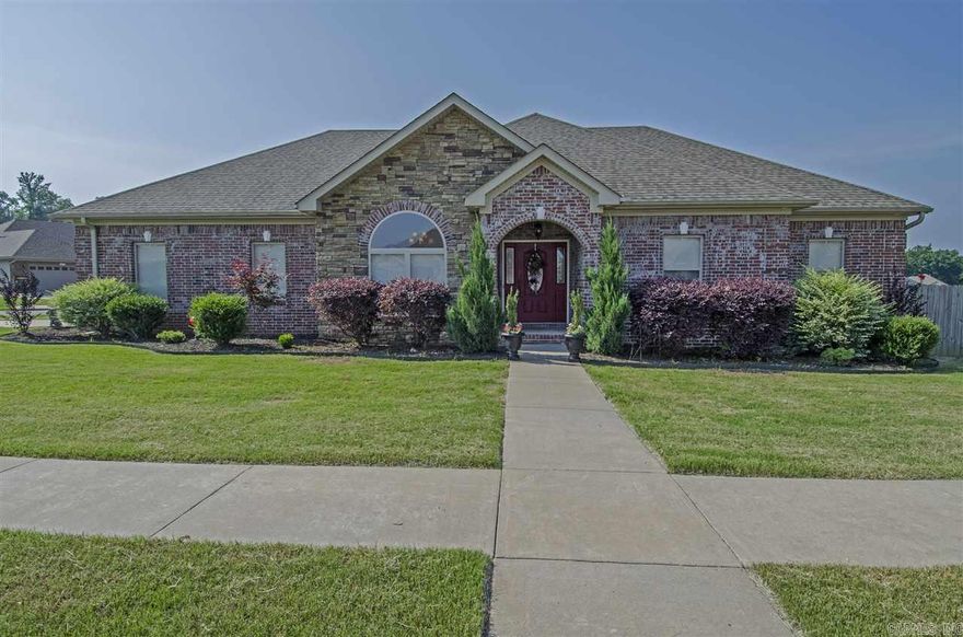 Beautiful 4 BR, 2 BA home sits on large corner lot-Large master bedroom with  SPA retreat master bath; extra large garage; architectural lighting, extra large covered deck. Great space to entertain.  All new paint through out home, all new carpet & engineered hardwood floors. Community lake for fishing plus playground and picnic area.