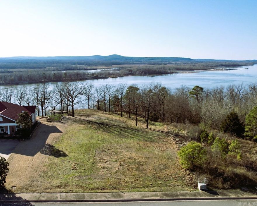 This is a wonderful opportunity to purchase this amazing lot. It's basically level with a nonobstructed view of the Ar River and Pinnacle Mt. This is one of Maumelle's most sought after Gated Communities! Spectacular views of the Ar River and Pinnacle Mountain with Breathtaking Sunsets!! This is the ultimate dream lot to build on. Have you always wanted to Design your own home?  Let me help you make that DREAM a reality! Underground utilities to include; water, electricity, gas, sewer and high speed ATT fiber internet! Minimum sq ft requirements are 2500 sq ft.  Gates are open on Sat and Sun from 1-4. Call for a gate code on other days.
