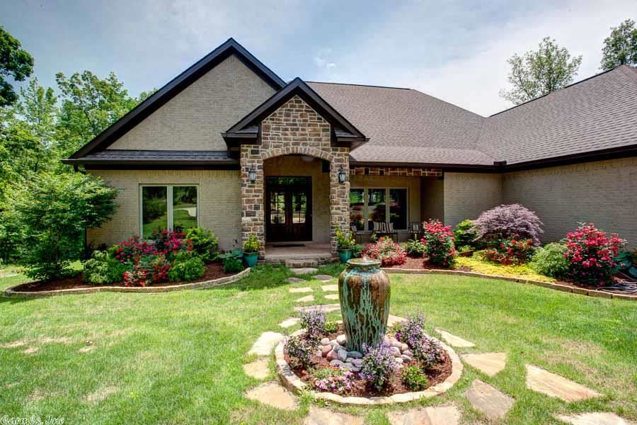 Custom built home loaded with amenities in immaculate condition. Very open floor plan. Sits on 3 acres with gorgeous views. Lives like a one level with 3 bed/2.5 baths on main level. 2nd level is a huge room with lots of storage. Great for game or play room. Gourmet kitchen with energy efficient appliances. Energy Home Masters Trane HVAC. Large covered patio includes a screened in porch. Central vac, sprinkler system, alarm, professional sound system in/out. TONS of storage. 3 car side loading garage.