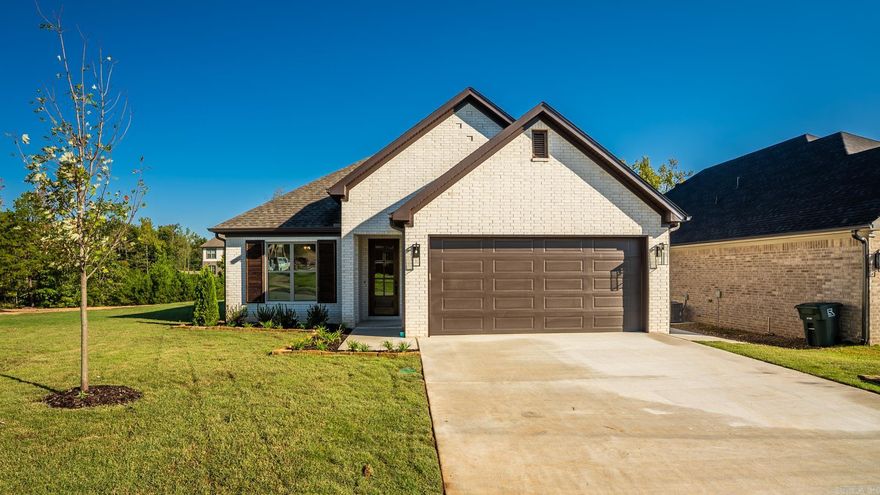 Welcome to Edgewood – West Little Rock’s new neighborhood! This home, being built by Graham Smith Construction, offers the perfect blend of style, comfort and privacy. This completed home is designed for modern living with open-concept spaces and high-end finishes throughout. As you step inside to an open concept living area you will find tasteful designer finishes throughout. The gourmet kitchen boasts quartz countertops, custom cabinetry, stainless steel appliances, and a large island with a breakfast bar, perfect for casual meals or entertaining. The primary suite is your private retreat, complete with a spacious walk-in closet and a spa-like en-suite bath, featuring a double vanity, soaking tub, and separate shower. Two additional bedrooms and a full bath provide ample room for family or guests. Enjoy the outdoors from your covered patio, and say goodbye to mowing  as lawn care is included when you own at Edgewood. This is your chance to live in luxury, with easy access to everything West Little Rock has to offer.
