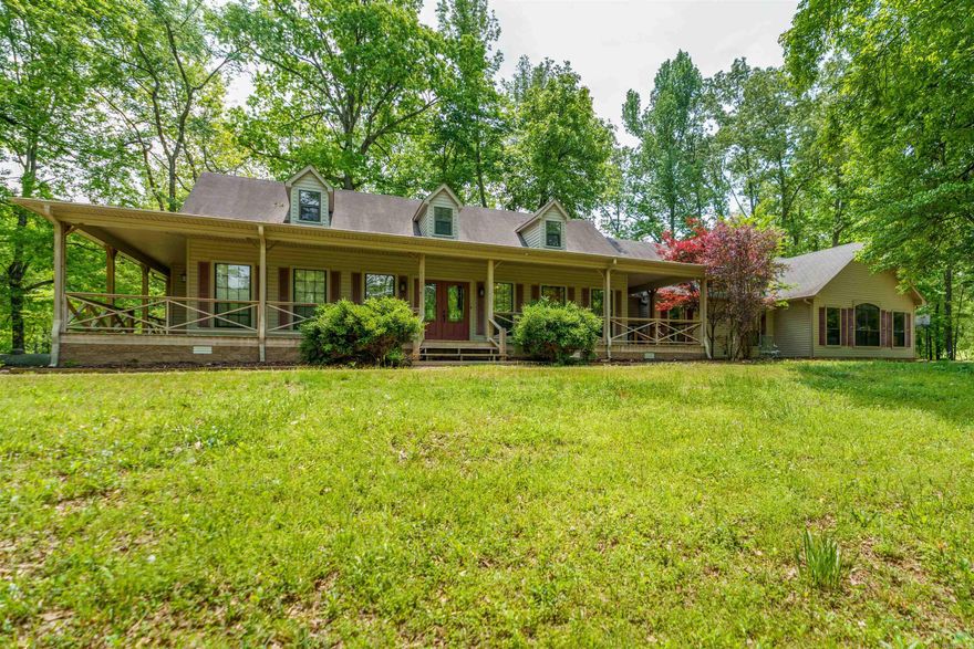 Welcome to your dream homestead! This beautiful 4-bedroom, 3-bath home offers 3,000 sq ft of comfortable living space on a level 7.93-acre property less than 1 mile from Jessieville school. This home is perfect for those seeking space, privacy, and the charm of country living. Step onto the inviting wraparound porch and take in the views of wildlife all around. Inside you'll find two generous living areas, woodburning fireplace, gleaming hardwood floors and a wall of windows to enjoy the natural light. The thoughtfully designed kitchen features granite countertops, stainless steel appliances and a large walk-in pantry. The spacious laundry room could double as a craft room. And don't forget about the drop zone built for convenience and functionality. The property also features an oversized 2 car garage with a separate 3rd ATV garage. Outside you'll find a flowing creek, RV hookup, barn and fencing for livestock, so whether you're starting a hobby farm or simply want wide-open space, this property offers that flexibility and freedom. NEW ROOF 2025! Recent deck repairs have been completed. BONUS, Seller is offering $10k credit towards updates/repairs or closing costs!