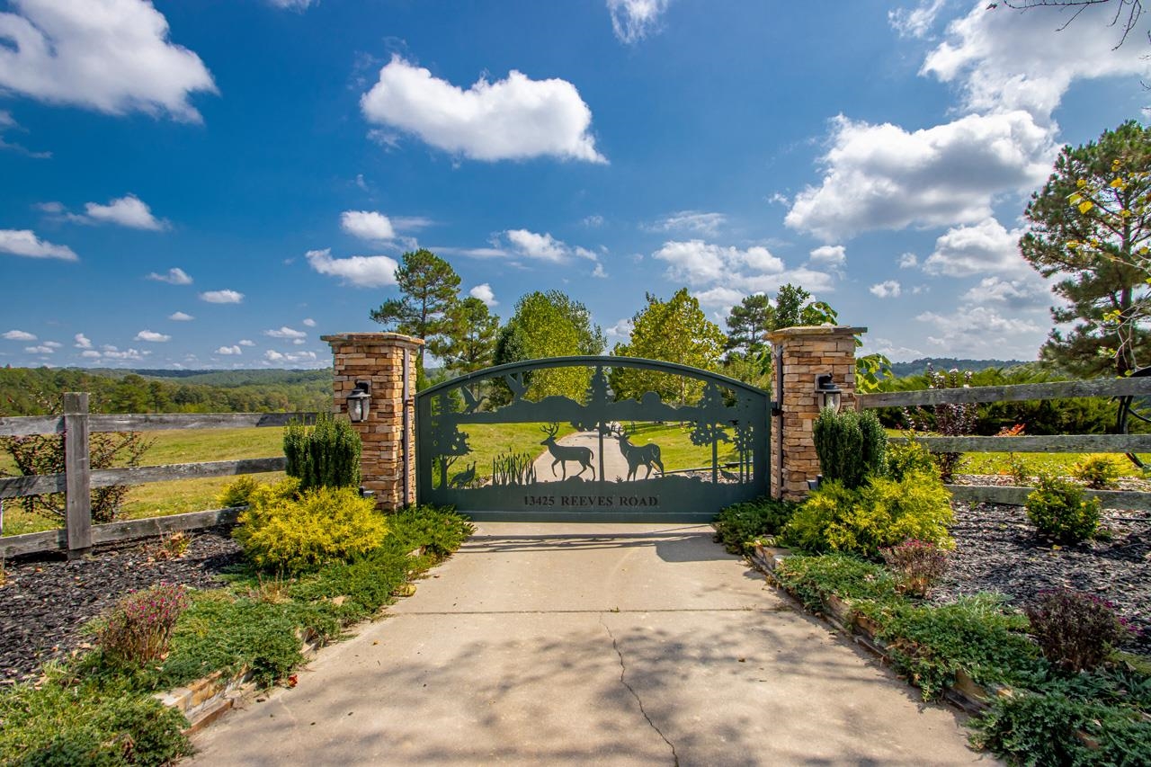 Beautiful Custom Built home on approx. 28.4 Acres. This 4 Bedroom 3.5 Bath home has an open floor plan with a gorgeous stone floor to ceiling wood burning fireplace, theatre room, formal dining room and tons of walk in attic storage. The three car garage has a custom installed tornado shelter. The shop is approx. 2500 sq feet and is wired and plumbed. The lean to attached to the show is wired for your RV or camper. Seller has had the home appraised and appraisal is available upon request.