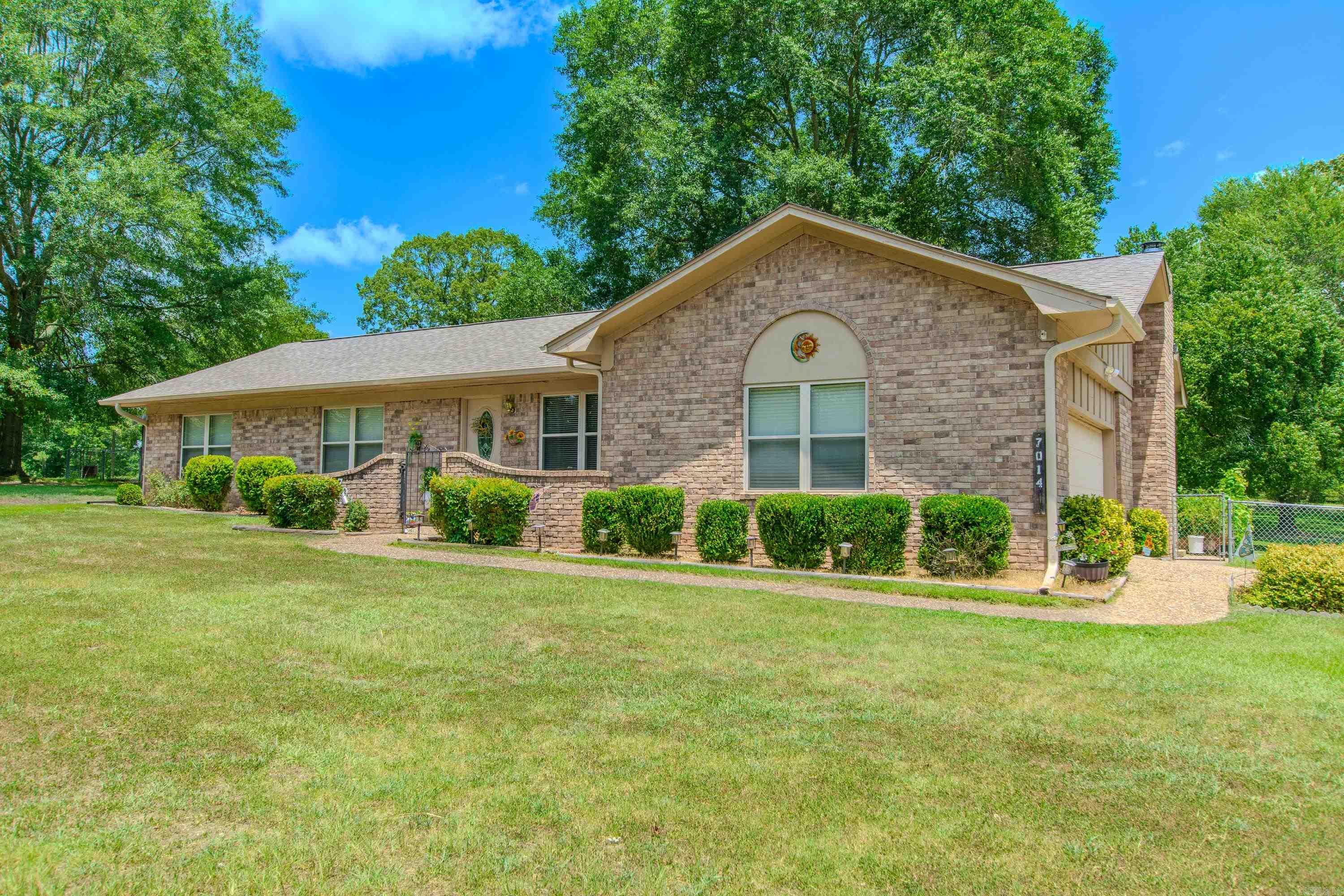 3 Bedroom, 2 Bath with open Living, Dining and Kitchen, all on 1.12-acre corner lot. No carpet, wood and tile flooring thru out for easy maintenance. All brick home situated across from Lake Krislor. Home has beautiful older shade trees and large covered patio and easy maintenance landscaping. There are also 2 sheds that convey, both have electricity. 2 car side load garage. All residents have access to Lake Krislor, also Include's a boat ramp. There are no association fees. New roof 2023, new leaf guard gutters 2023, HVAC 2016.