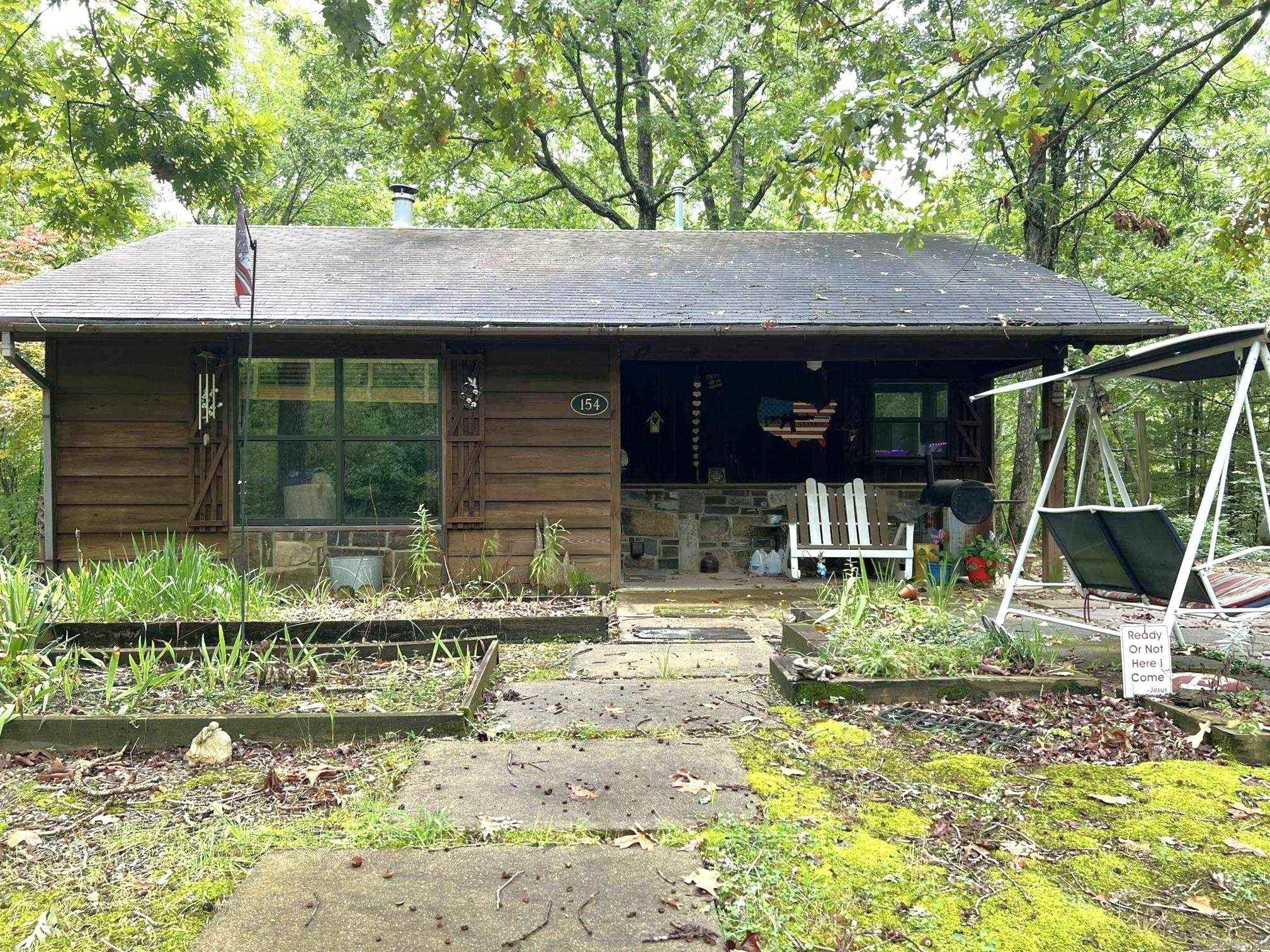 Looking for an adorable cabin in the woods, with National Forest Boundaries? This is it! 2 bedroom, 1 bath, 786 square foot cabin situated on 2.48, newly surveyed, rolling acres. The wooden ceiling throughout home creates warmth and beauty . Cozy up to the wood burning stove in the living area during the winter months. Hop onto your atv and go for a ride in Wolfpen Gap or just minutes drive to the new bike trails on Rich Mt. Do not wait! This will not last long! Secure your piece of the Ouachita Mountains. Agents please see showing remarks.