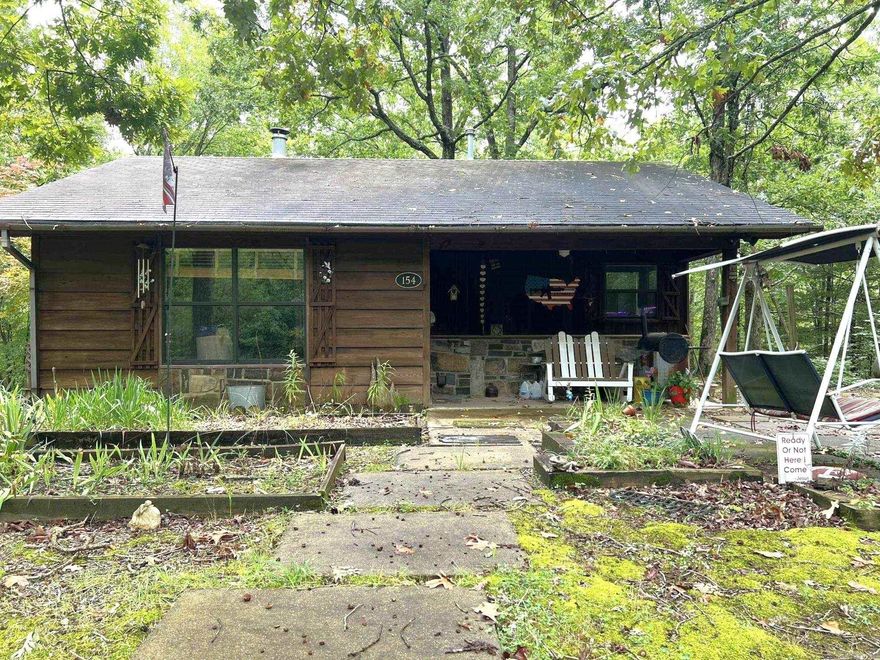 Looking for an adorable cabin in the woods, with National Forest Boundaries? This is it! 2 bedroom, 1 bath, 786 square foot cabin situated on 2.48, newly surveyed, rolling acres. The wooden ceiling throughout home creates warmth and beauty . Cozy up to the wood burning stove in the living area during the winter months. Hop onto your atv and go for a ride in Wolfpen Gap or just minutes drive to the new bike trails on Rich Mt. Do not wait! This will not last long! Secure your piece of the Ouachita Mountains. Agents please see showing remarks.