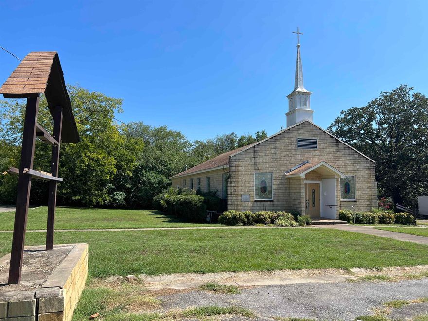 ANY USE CONSIDERED for the old church building. 1.76 acres, two buildings in the rural area of Van Buren, AR. church building approximately 3300 SF with sanctuary, fellowship hall, kitchen, 2 restrooms, 3 classrooms, and dining area. The old parsonage, approximate 1200 SF, has a tenant that has been there for 7 years. Do not disturb. Hoping to sell with the tenant in place. Ownership will transfer through special warranty deed-Trustee Deed. Agents see Agent Remarks