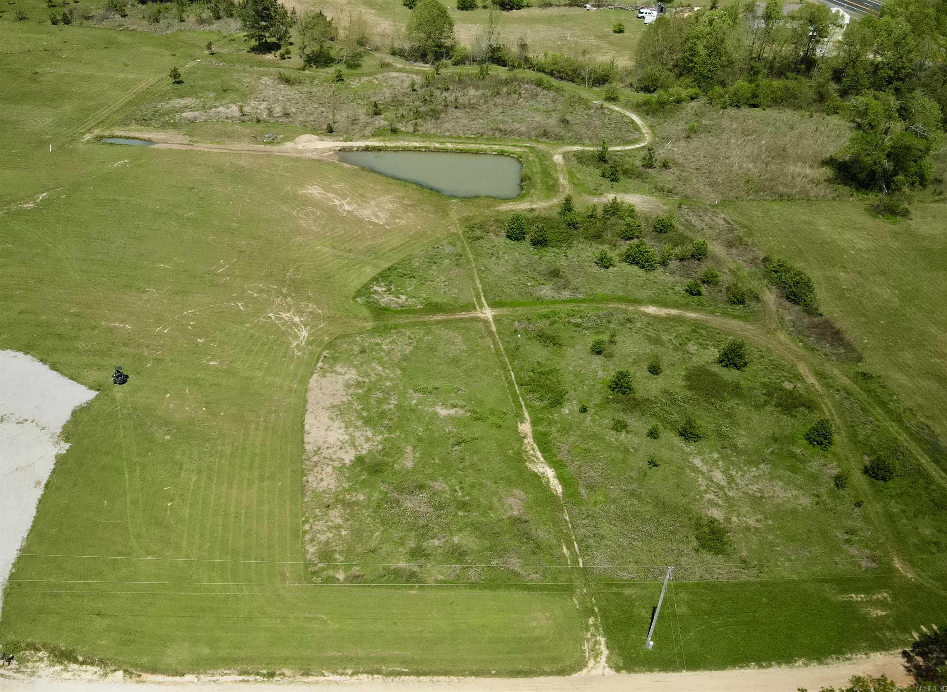 4.58 Acres with a Pond and Creek to build your Dream Home on! Don't Miss It! Utilities at the street.