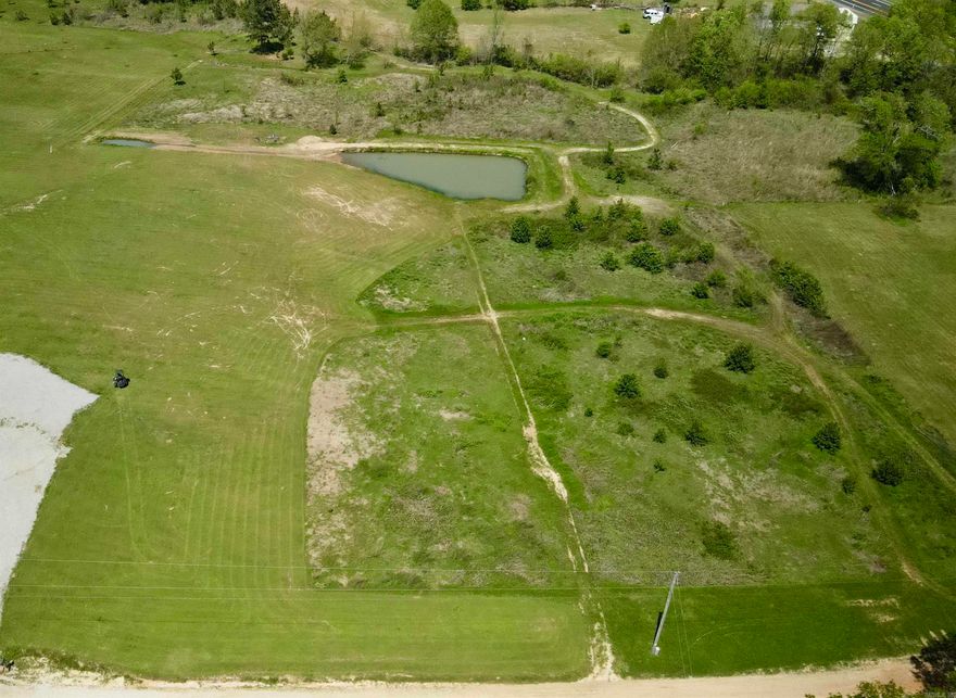 4.58 Acres with a Pond and Creek to build your Dream Home on! Don't Miss It! Utilities at the street.