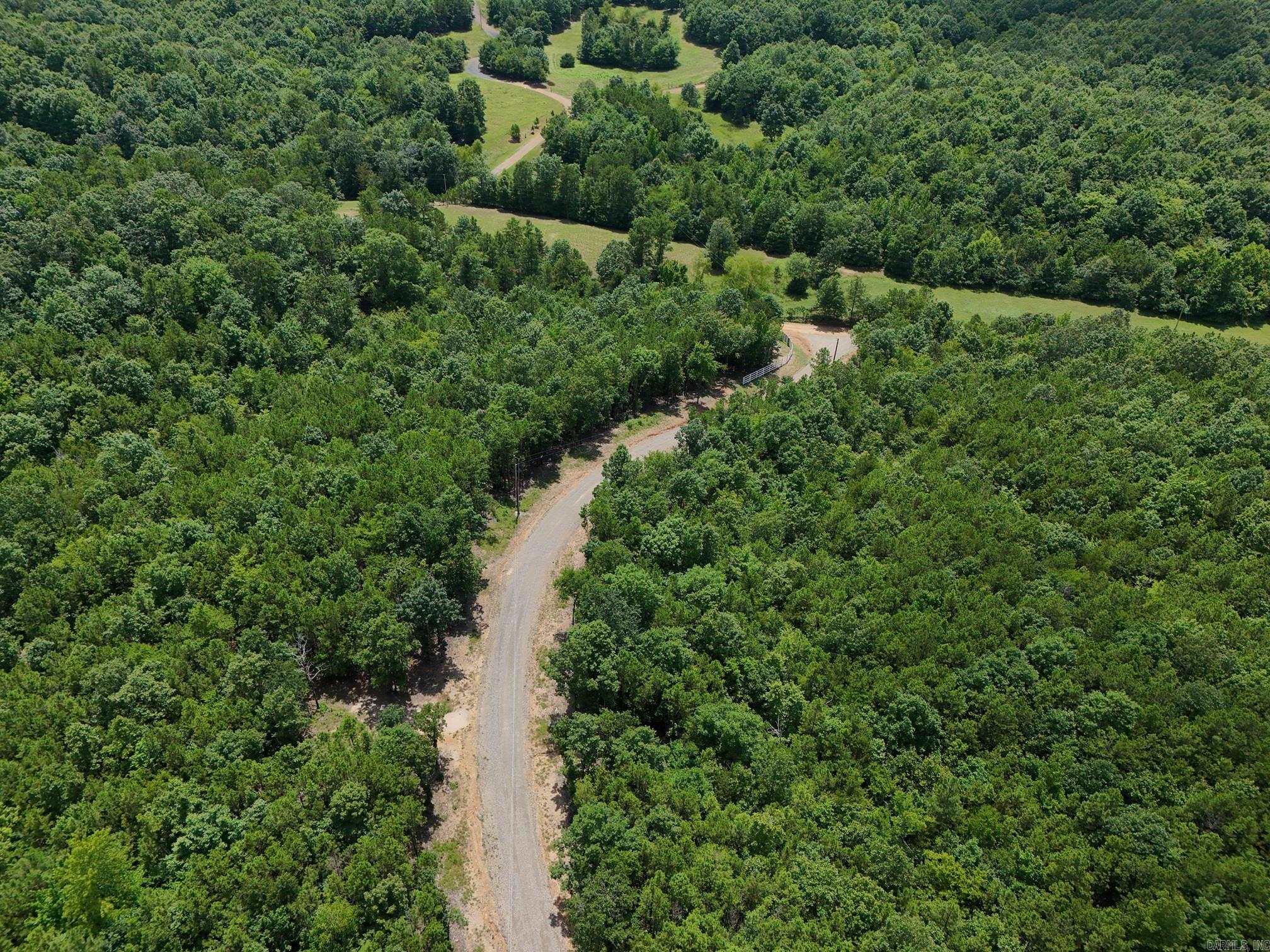 2.955 acre tract in the beautiful Rustic Ridge Subdivision, ready for your new home! Enjoy mountain views, peaceful surroundings, wildlife, and a great location just minutes to downtown Mena. Ride straight to the Wolf Pen Gap west trailhead which is just 12 miles away. Electric is available, and a survey is completed. This lot is a beautiful place to build, relax and explore - come take a look today!