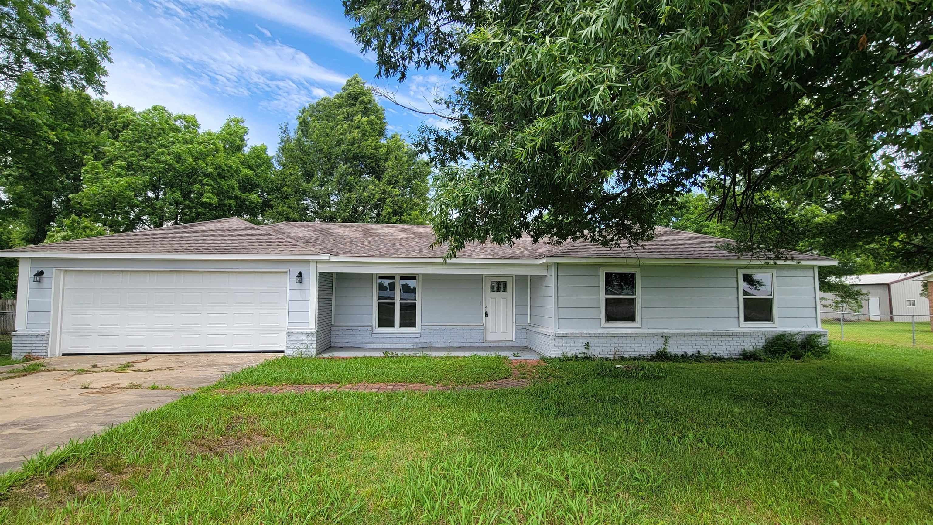 Beautifully remodeled home inside and out. This 3 bedroom, 2 bath home has over 1500 square feet and includes new flooring, new interior paint, all new kitchen appliances, and new HVAC system in 2024. Open concept floorplan. Living room with fireplace. Kitchen with breakfast bar. Arched doorway leading through hallway. Separate laundry area, office space, and storm shelter. Walking distance to school. Seller is offering to pay up to $3,000 of buyers closing costs.
