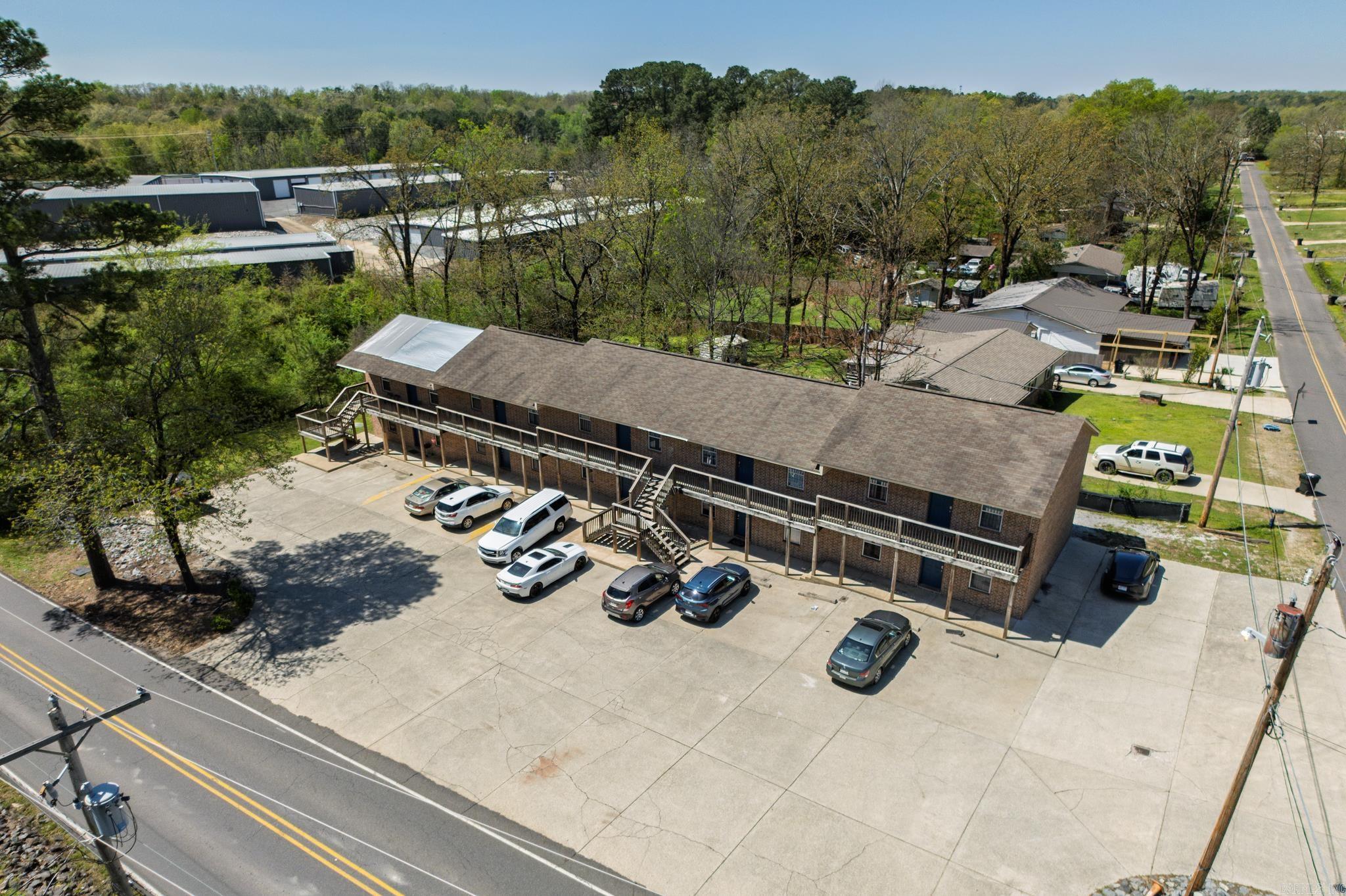 Discover a fantastic investment opportunity with this 10-unit apartment complex located near the lake in beautiful Hot Springs, Arkansas. Situated in the highly regarded Lake Hamilton School District, this property features ten spacious 2-bedroom, 1-bath units. Each unit offers a comfortable layout with strong rental potential, currently achieving a maximum rent of $750 per month. The complex's proximity to the lake adds to its appeal, making it attractive to tenants and investors alike. All units are metered separately, and tenants are responsible for all utilities. With steady rental income and potential for future appreciation, this property is a smart addition to any portfolio. Showings are available by appointment only.