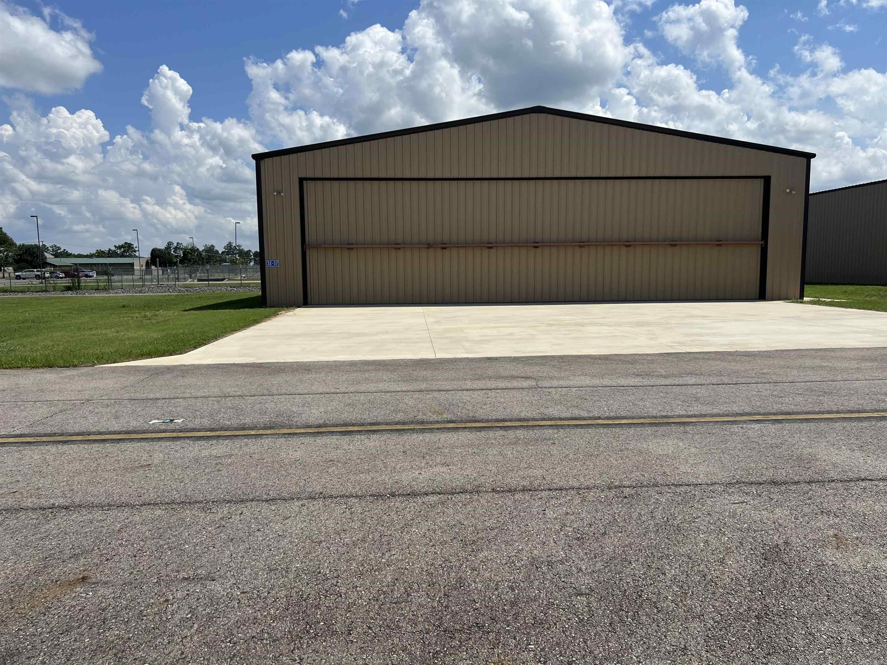 Perfect location at the Searcy Municipal Airport. Available for move-in, new built stand-alone insulated airplane hangarm large enough for King Air plane. 55x70 metal building, 60x16 overhead door and 8 ft overhead door. Half bath. Property offers electric gate access enhancing safety and convenience. SEE AGENT REMARKS!