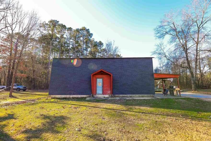 Unique A-frame with lots of personality!  Lofted living room ceiling with built-in storage is the highlight of this rural property, with easy access to the primary bedroom upstairs, and galley kitchen, laundry, and 2 bedroom on the lower.  Sitting on 1.2+ acres in the Harmony Grove School District, it's also just miles from the Highland Park for a short commute.  The storage building is partially finished, with workshop space and a lean-to.  With a handful of neighbors, this little cul-de-sac development offers the rare blend of privacy and convenience.