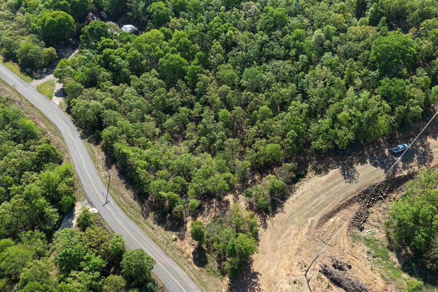 Introducing Seven Lakes Ranch Estates ~ a premier gated acreage community redefining luxury country living in the Conway area. Set against breathtaking views of Lake Conway and Pinnacle Mountain, this exclusive development features seven stocked lakes, scenic nature trails, rolling topography, and abundant wildlife. Each 3–5 acre homesite offers the privacy and space you’ve been searching for, complete with paved roads, a gated entrance, and available utilities. Perfectly positioned just 10 minutes from I-40 in Mayflower, 15 minutes from downtown Conway, and approximately 25 minutes from West Little Rock and Cabot, Seven Lakes Ranch Estates delivers both tranquility and convenience. With community-wide road paving planned for summer 2026, and a 1800 sq. ft. minimum for this lot, you’re invited to bring your builder—or work with one of ours—to craft a custom home that fits your vision.  **Owner financing is available.**