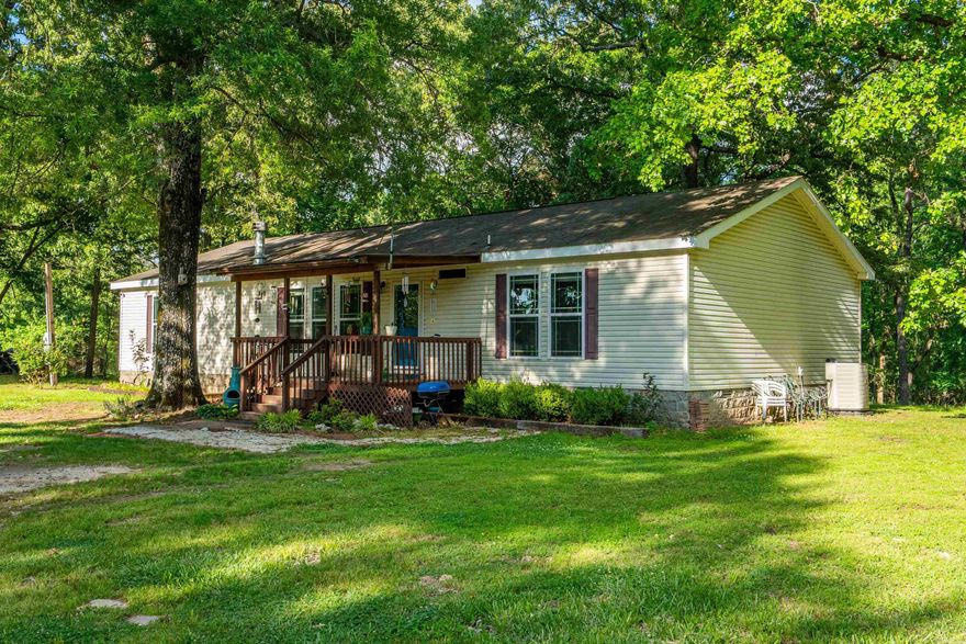 This charming three-bedroom, two-bathroom home sits on 2.62 acres surrounded by beautiful, mature trees. The exterior is well-maintained with a durable architectural shingle roof and includes two sheds for all your outdoor storage needs. Inside, the spacious master bedroom and ensuite serves as a true retreat featuring a soaking tub, walk-in shower, and "his and her" closets with a dedicated linen closet. The layout is thoughtfully designed with ample storage space found throughout the entire home. This property offers the perfect blend of interior comfort and expansive outdoor acreage. Located in the Lake Hamilton School District.