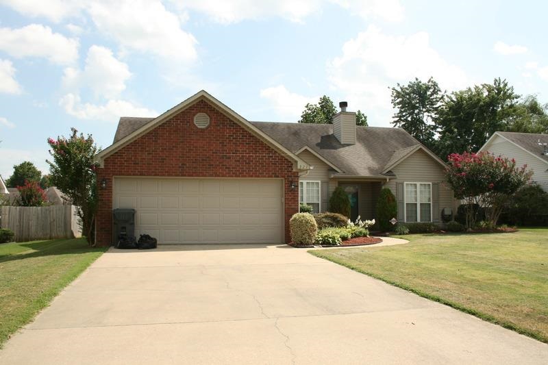 This home with beautiful landscaping gives great curb appeal. As you step inside, you will be greeted by the cozy family room with hardwood floors, a gas log fireplace and built-ins. The eat-in kitchen is just ahead and features a breakfast bar, a desk space and abundant wood cabinetry. The spacious master boasts plush neutral carpeting, a warm color scheme, a walk-in closet and dual vanities in the master bath. Additional amenities include a two car garage, a laundry room and a privacy fenced back yard.
