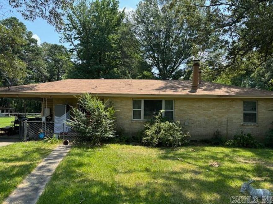 Great investment opportunity! Fully fenced 2BR/1BA brick house with a storage building on almost an acre. Features include newer roof, newer hot water heater, updated wiring, gas fireplace, and a sunroom