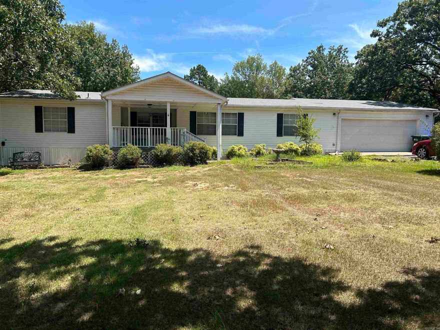 Well maintained home with attached garage and 21x21 metal shop on one acre level lot on the top of Round Mountain.