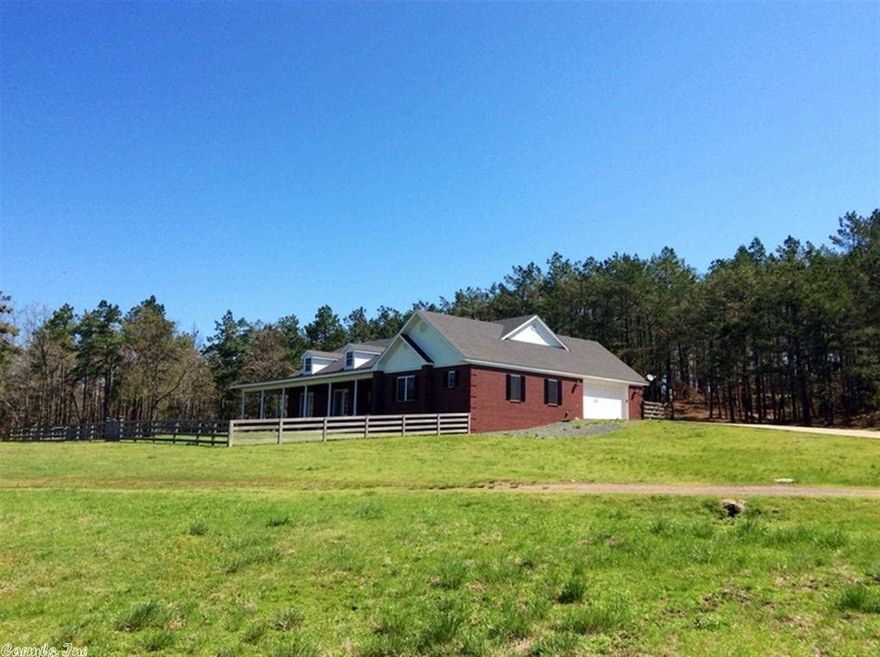 ALMOST 100 ACRES and  3BR 2 1/2 bath brick home.  About 2745 sq ft heated & cooled, plus porches and oversized garage.  French doors and crown molding.  Exquisite chair rail in formal dining room. Kitchen  has custom  cabinets, pantry, double wall ovens (top one is convection).  WBFP has Country Flame insert with ducting to other rooms plus CH&A.  Study/office off master bedroom with French doors.  MBR has French doors, leaded glass transoms.  Home overlooks land.  Suitable for horses/cows. 2 si Natl For