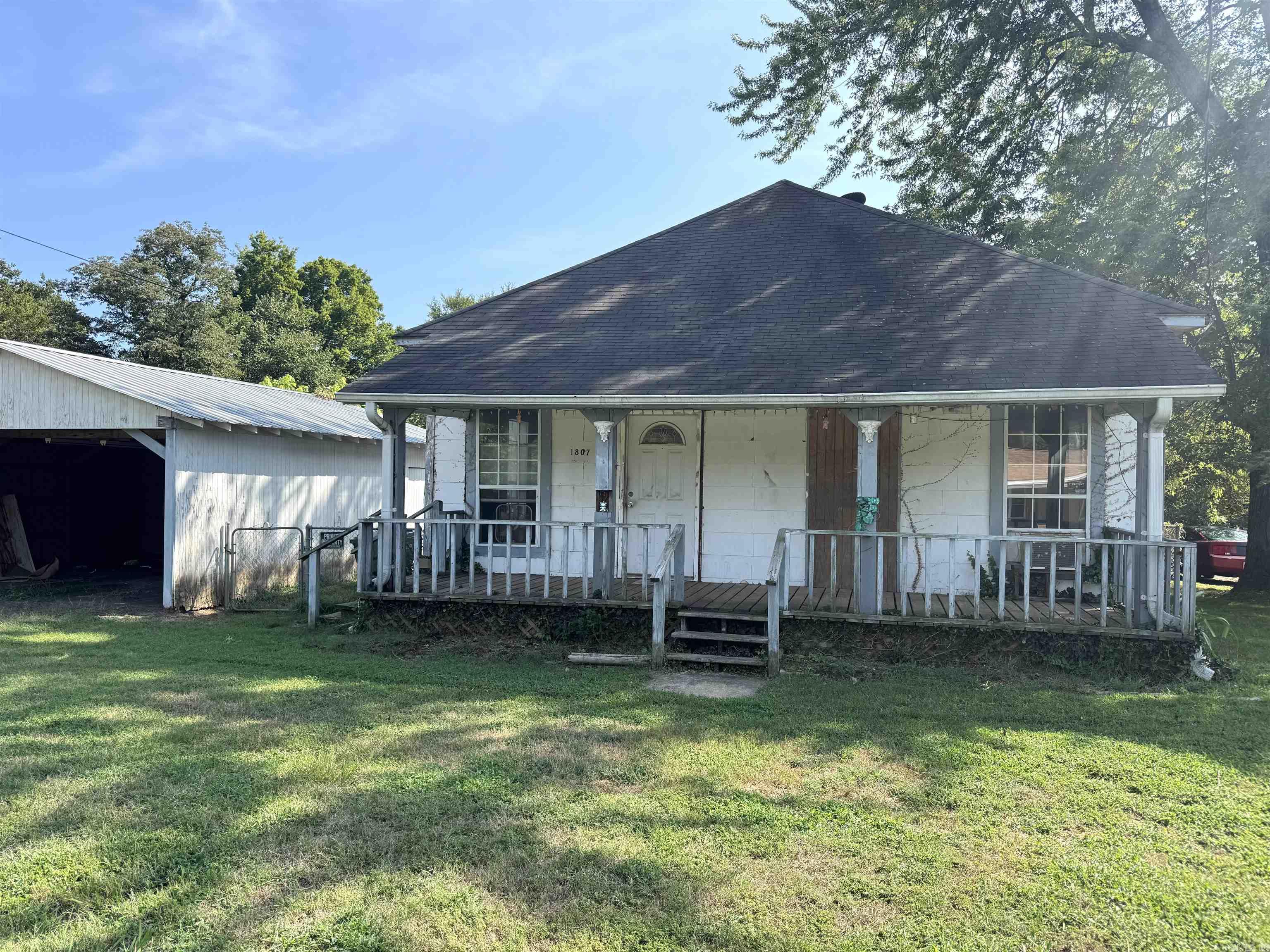 This 2-bedroom, 1 bath home offers great potential and is conveniently located close to schools, parks, and all the amenities of town. Built with character, the home features large wood-trimmed windows, original hardwood floors, a sunroom, and spacious layout ready for your updates. Sitting on a large lot, there is plenty of room for outdoor living, gardening, or possible expansion. With its timeless details, this property is the perfect project for an investor or buyer looking to bring new life into a home with charm. Being sold AS-IS, come see the possibilities today!