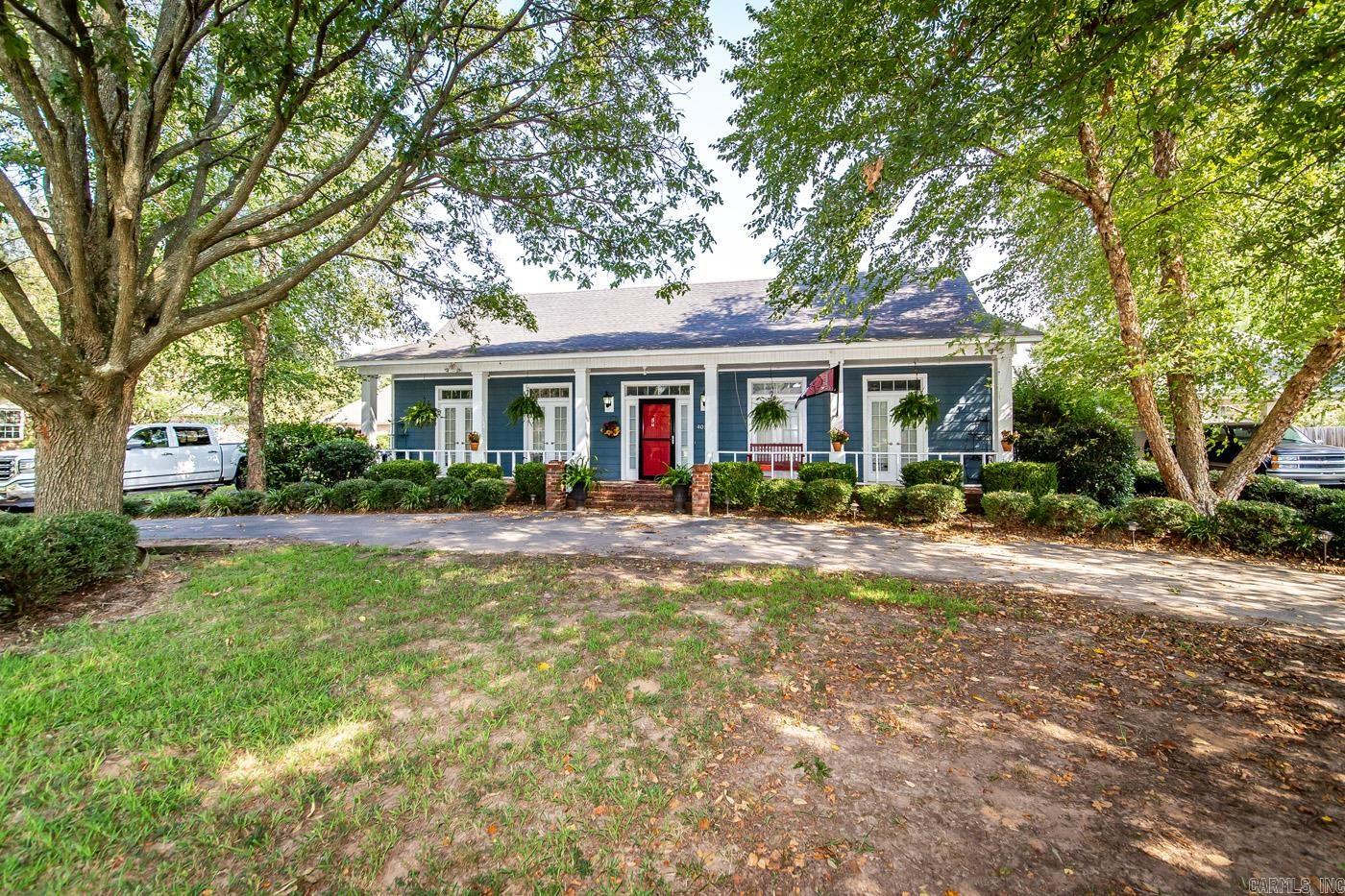 Want a Great House in a Great Neighborhood? Check out this unique 3-bedroom, 2-bathroom, one story home, with workshop and storm shelter. It offers hard surface flooring throughout with carpet in bedrooms, large walk-in closets, butcher block counter tops, 2 car and 1 car carports, screened in porch, separate patio and circle drive. Schedule a showing today! see agent remarks.