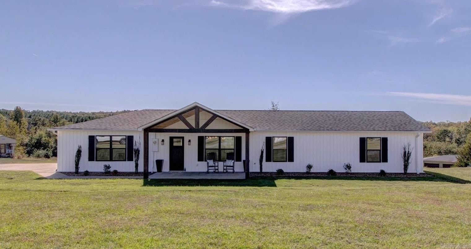 Fully Remodeled Lake Home ā Modern Style Meets Comfort! Every inch of this home has been completely transformed, blending timeless charm with upscale modern finishes. From the open-concept living spaces to the spa-like bathrooms.  Interior Features: All-new plumbing, electrical, recessed LED lighting, ceiling fans, & fixtures. Energy-efficient spray foam insulation, new sheetrock, doors, trim, & fresh paint. Luxury Vinyl Plank flooring throughout with tile in baths & laundry. Spacious open-concept living area highlighted by a shiplap fireplace. Dream Kitchen: Custom cabinetry w/ soft-close drawers & gold hardware Expansive quartz island w/ seating, farmhouse sink, & designer pendant lighting. Stainless steel appl, including stove, microwave vent hood, dishwasher & refrigerator. Stylish shiplap mudroom. Spacious bedrooms with walk-in closets. Guest bath with a custom vanity, LED light-up mirror, & statement tile floors Primary bath features a barn door entry, modern tile tub/shower with niches, and sleek Delta fixtures. New Covered patio, windows, roof, siding, and more. Min from Lacey's w/ a neighborhood boat launch. Call me today for a personal viewing!