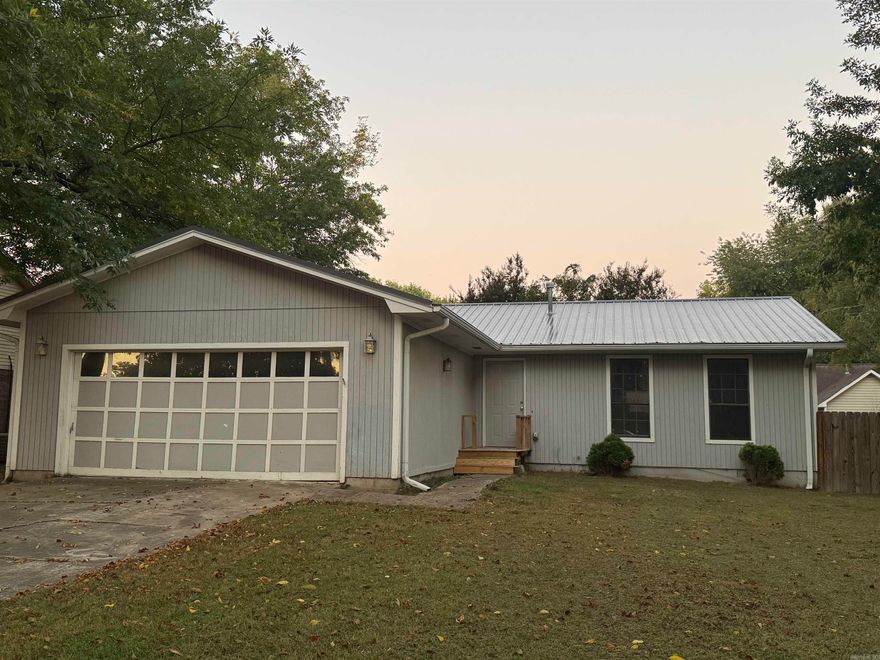 Welcome to this charming 3-bedroom, 2-bath home located in a quiet, established neighborhood in Searcy. This well-maintained property offers a comfortable layout with a spacious living area that flows into the dining space and kitchen, creating a warm and inviting atmosphere. The kitchen includes ample cabinetry, updated appliances, and convenient access to the backyard deck—perfect for entertaining or relaxing outdoors. The home features a mix of hardwood and vinyl flooring, a dedicated laundry room, and an attached two-car garage for added convenience. The metal roof adds durability and low maintenance appeal. Situated on a nicely sized lot, the backyard offers plenty of space for gardening or play. Located just minutes from schools, shopping, and dining, this home provides both comfort and convenience. Whether you’re a first-time buyer, downsizer, or investor, 15 Overlook Rd offers great value in a desirable Searcy location.