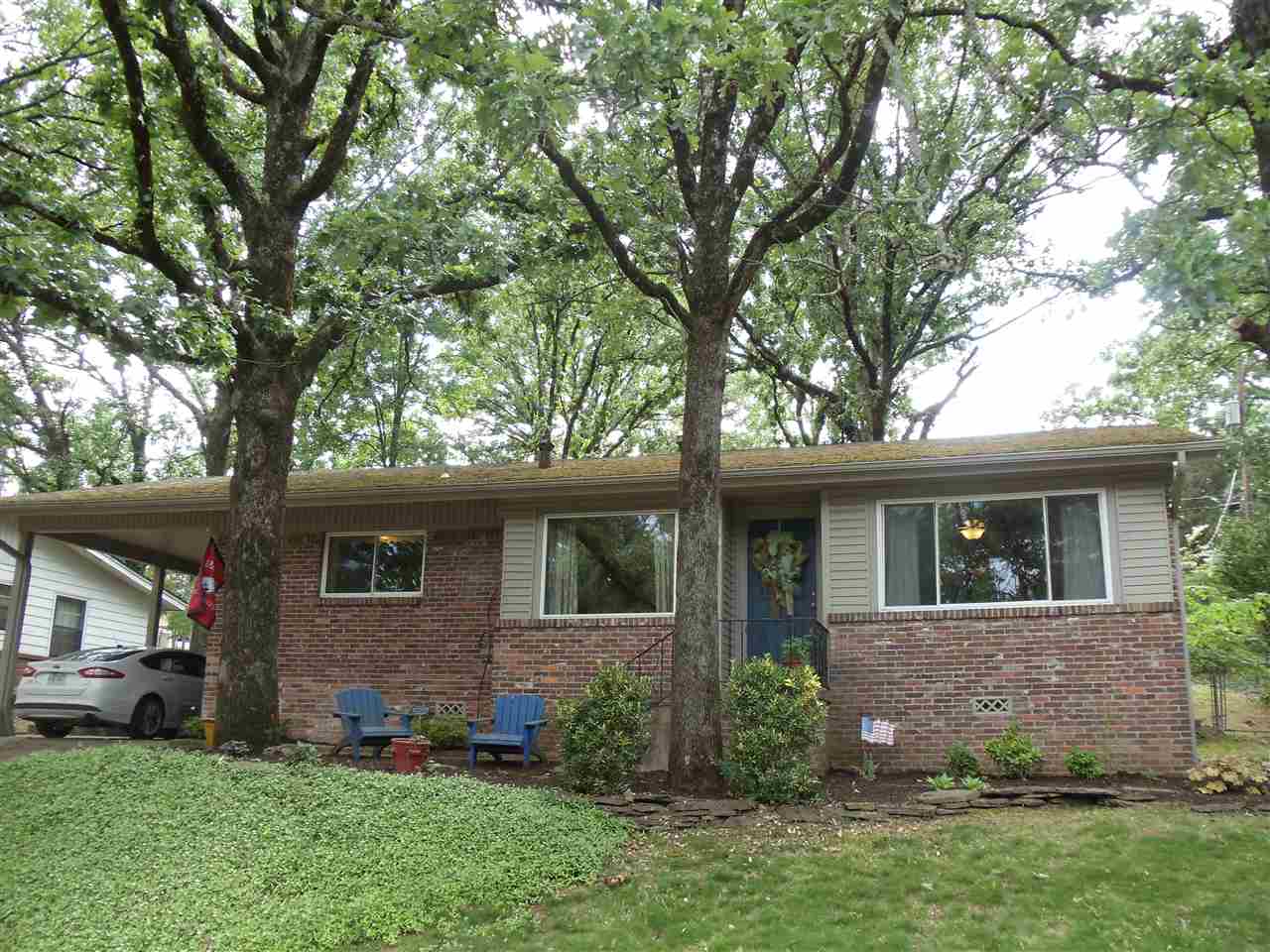 Great location in the heart of Lakewood. Beautifully updated kitchen with stainless appliances and gorgeous corian countertops. Hardwoods and tile throughout, except in playroom. Lake view from front and through the large kitchen window. Wonderful outdoor sitting area in front with view of the lake! 3 bedrooms, 2 baths, living area, and a separate bonus room/play room. One car carport and one car parking pad. A/C replaced in 2014.
